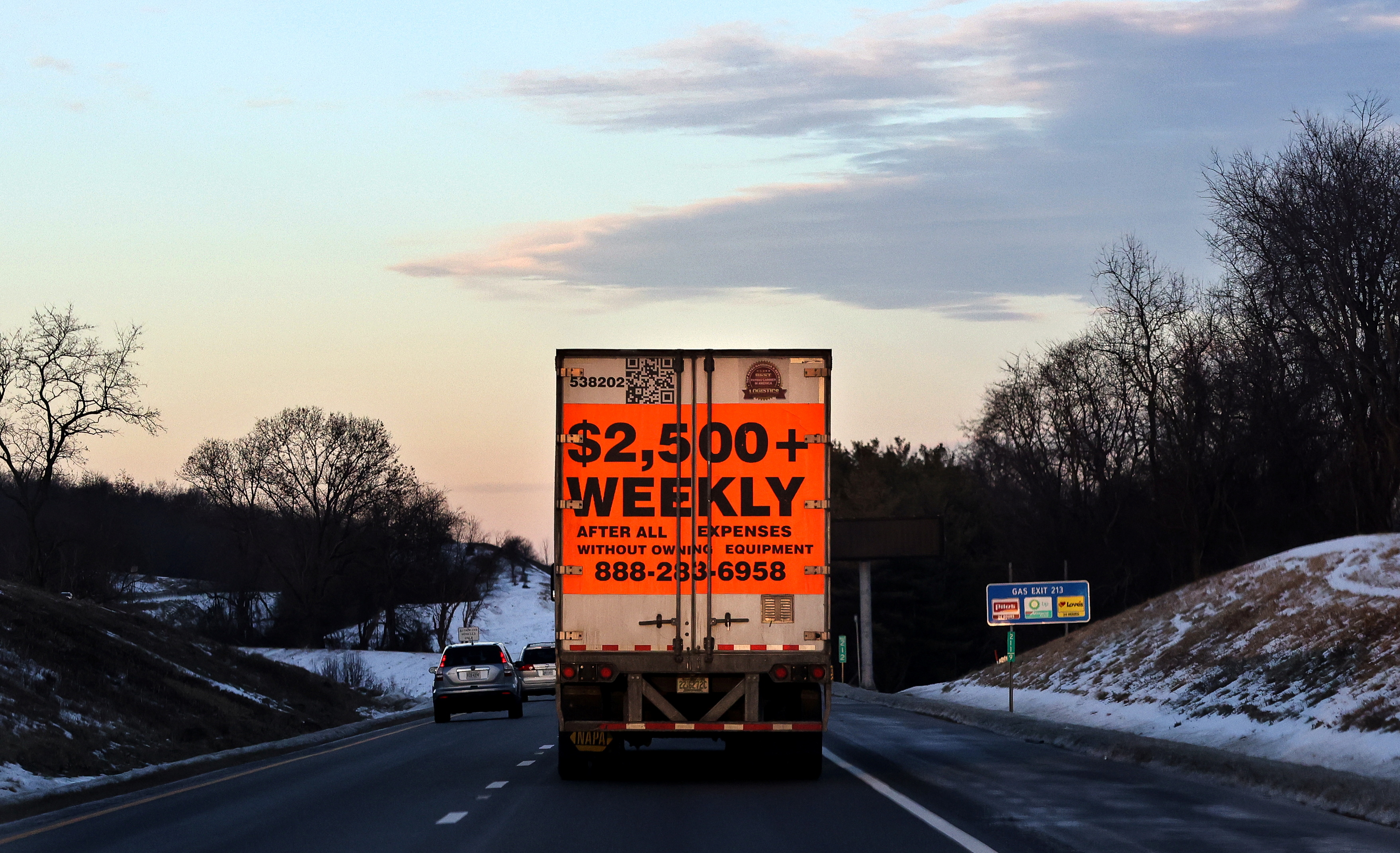 A tractor trailer advertising job opportunities drives south on Route 81 in Virginia