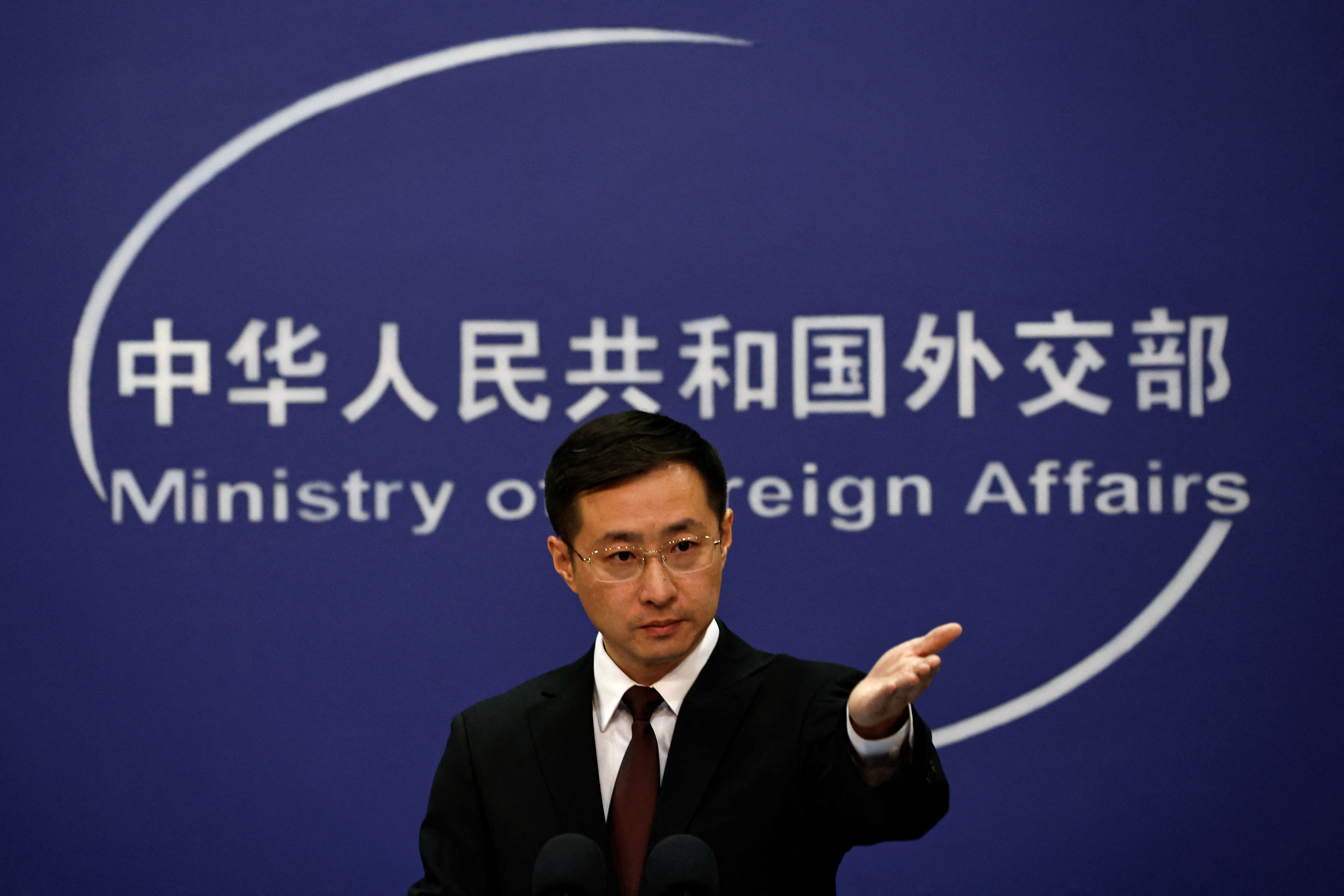 Chinese Foreign Ministry spokesperson Lin Jian gestures during a press conference in Beijing