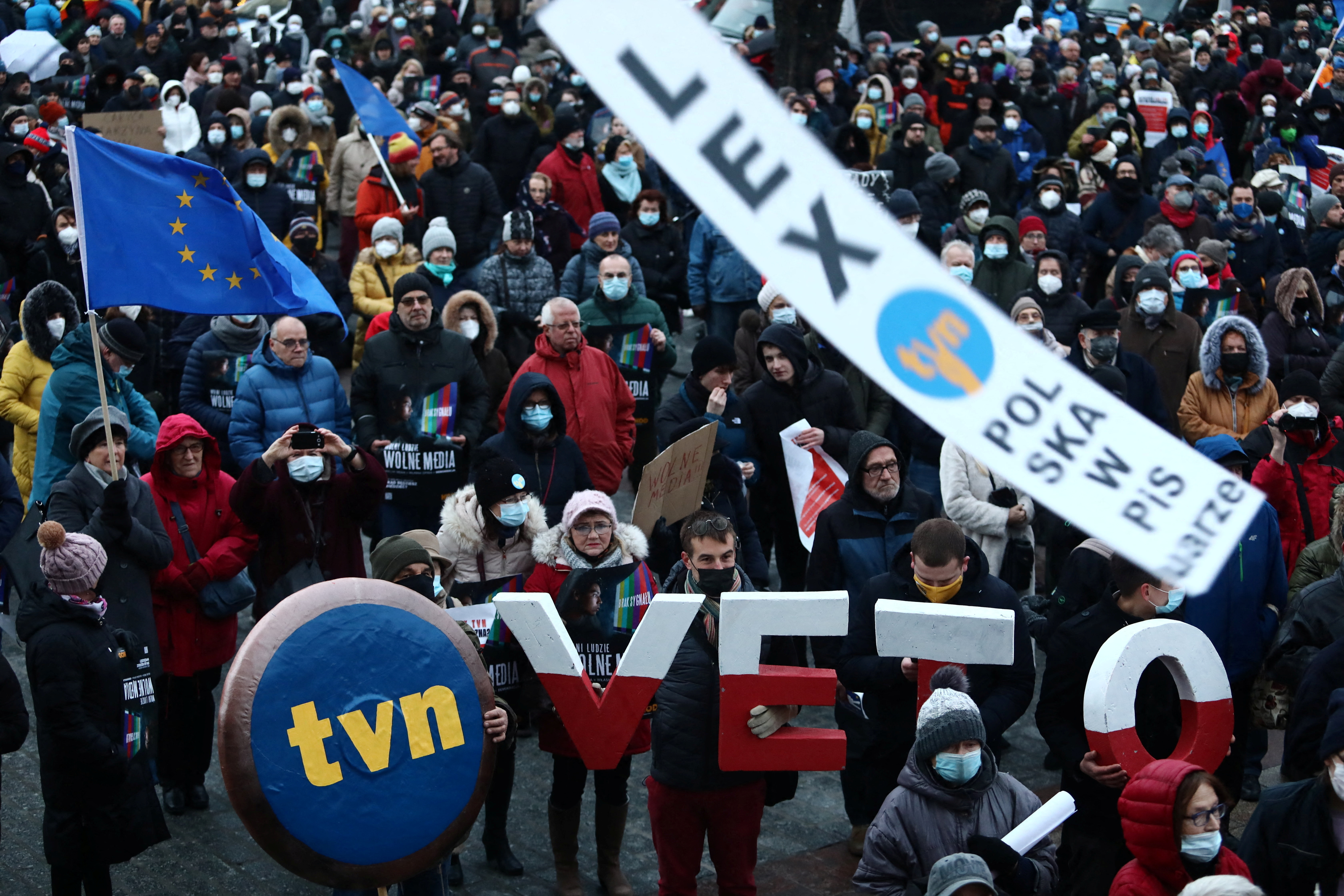 People protest against media law affecting U.S.-owned news channel in Krakow