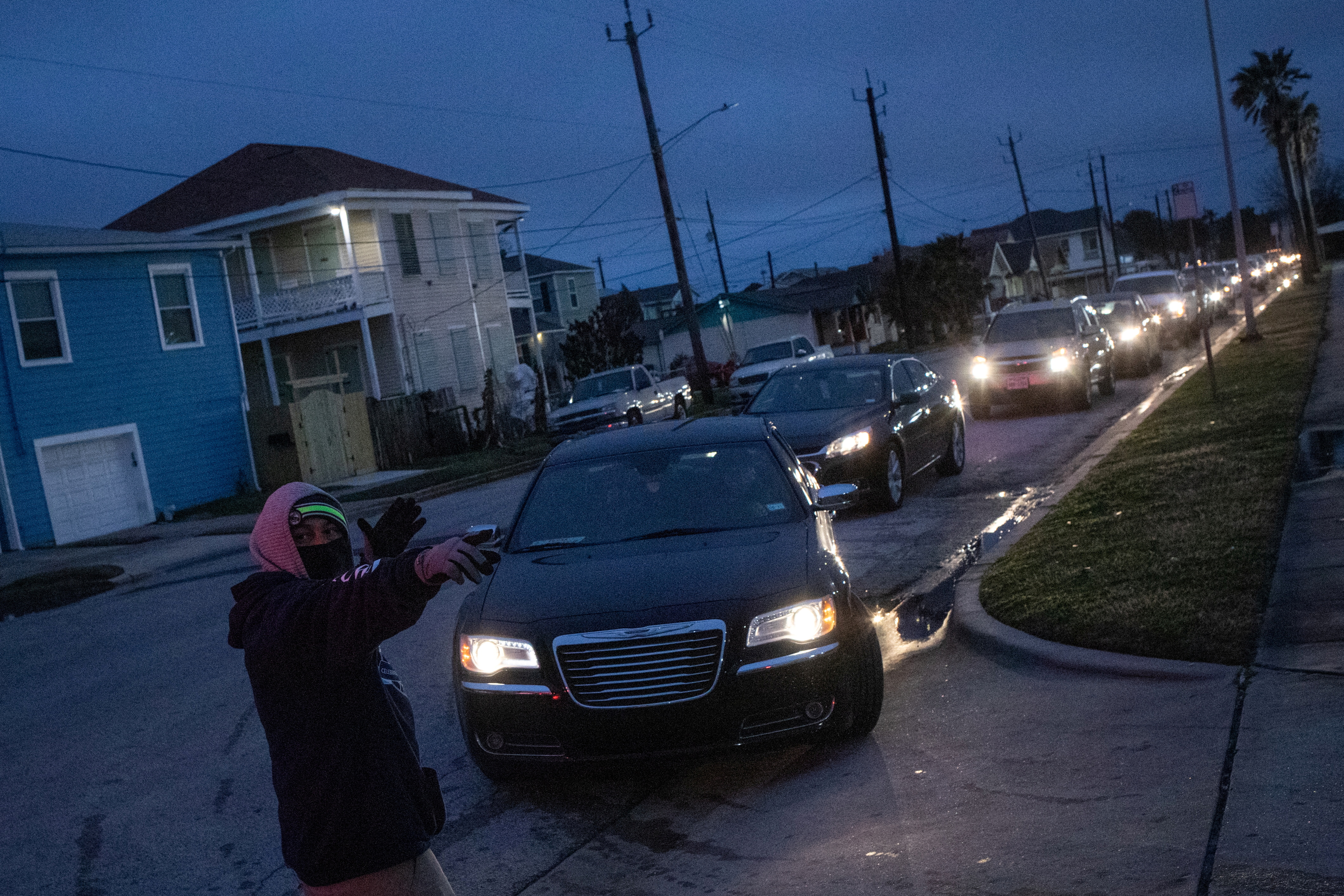 Residents line up to enter shelter after record-breaking winter temperatures in Galveston, Texas