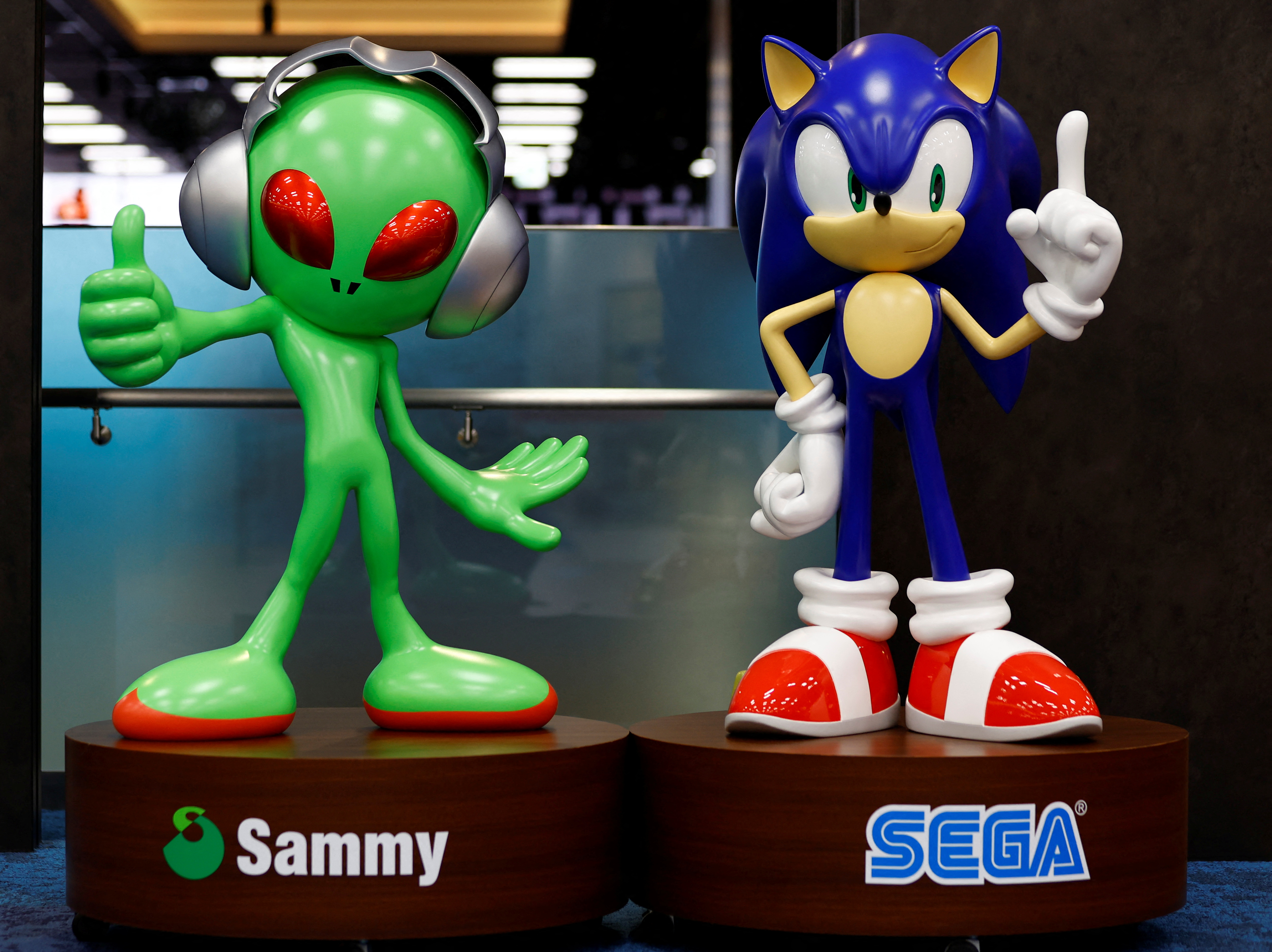 A model of Sega Sammy character Aliyan and  Sega character Sonic the Hedgehog are pictured at its headquarters in Tokyo
