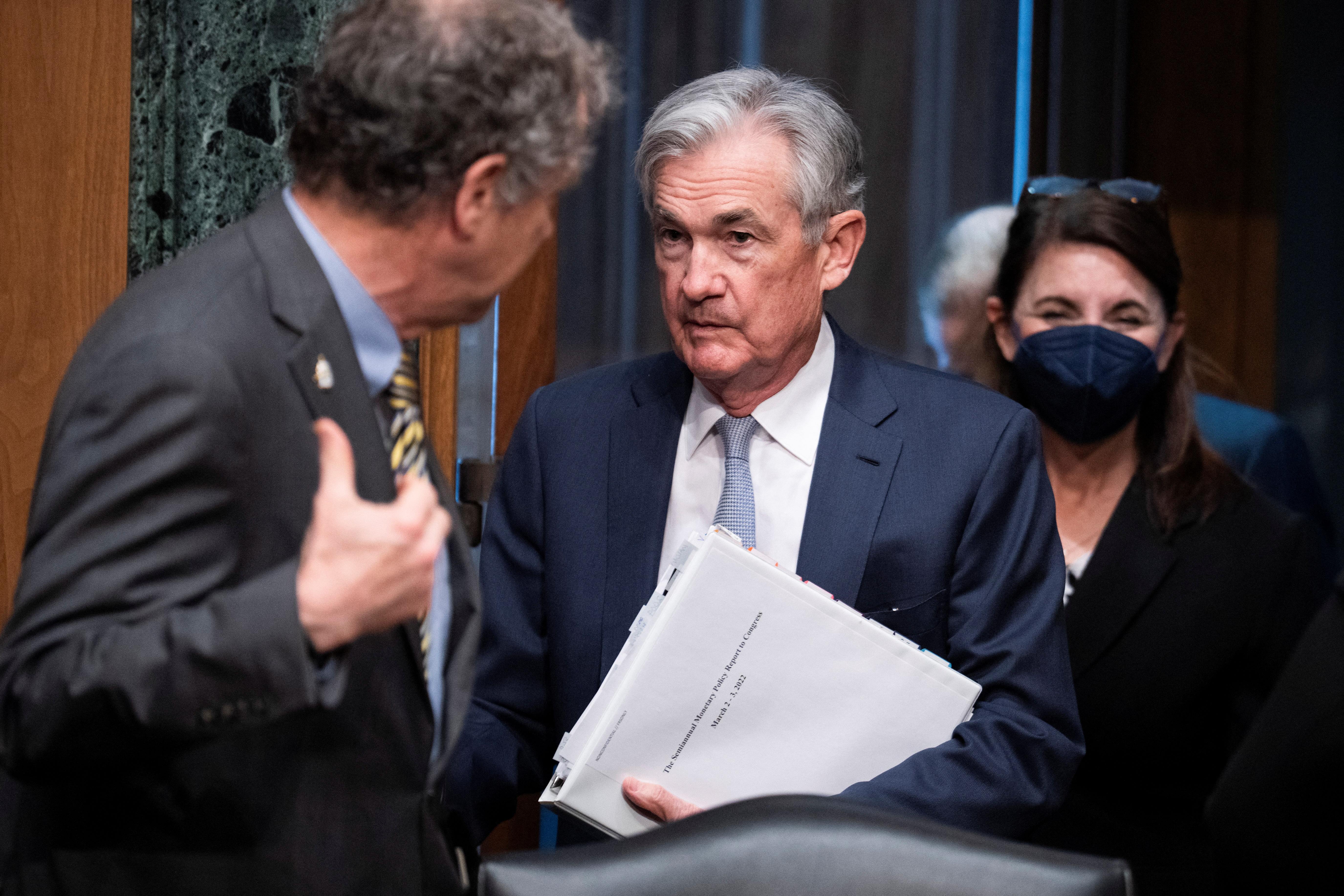 Federal Reserve Chairman Jerome Powell and Sherrod Brown (D-OH) arrive to testify before the Senate Banking Committee, in Washington, D.C.