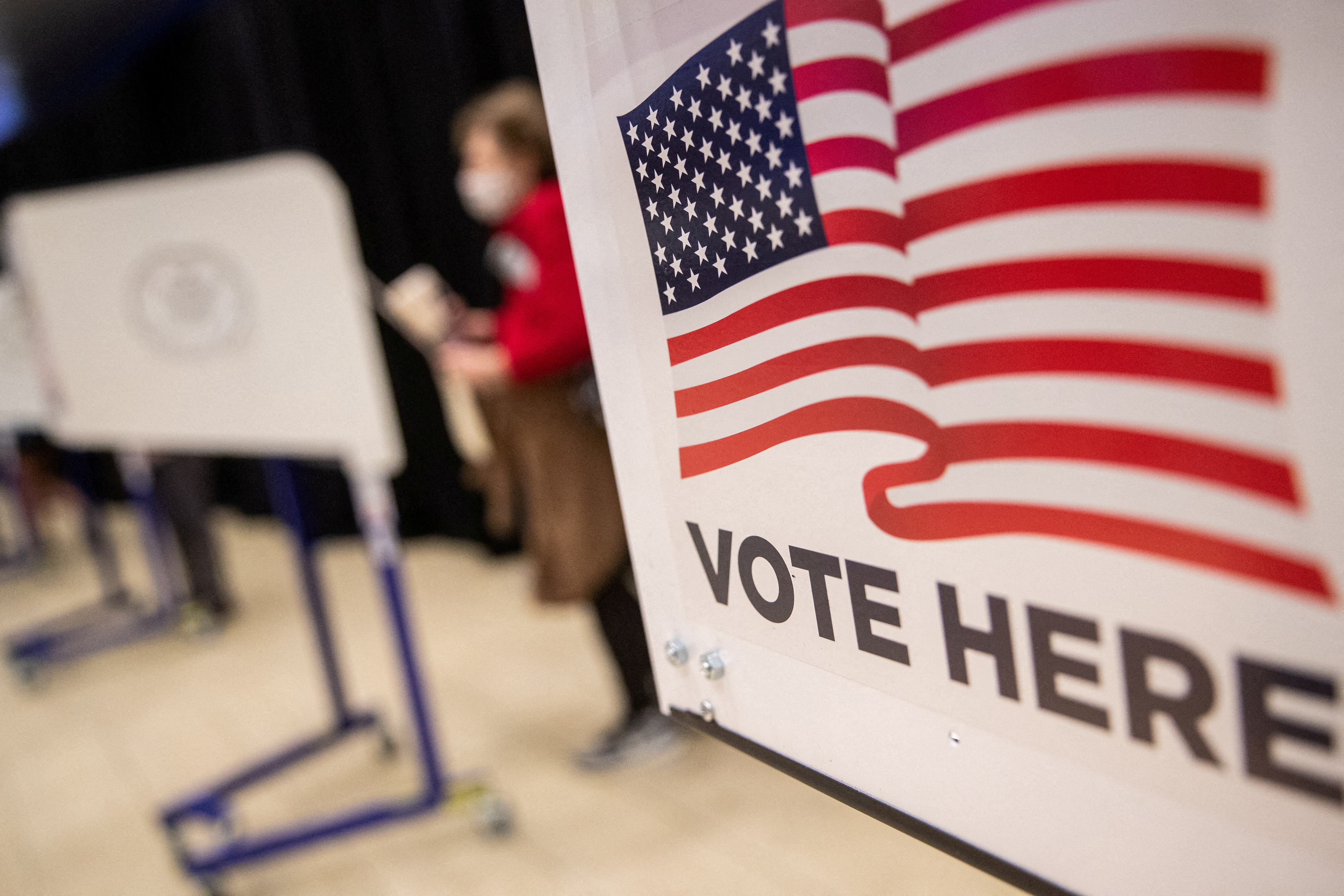 An American flag sign is seen on a voting booth at Madison Square Garden in Manhattan