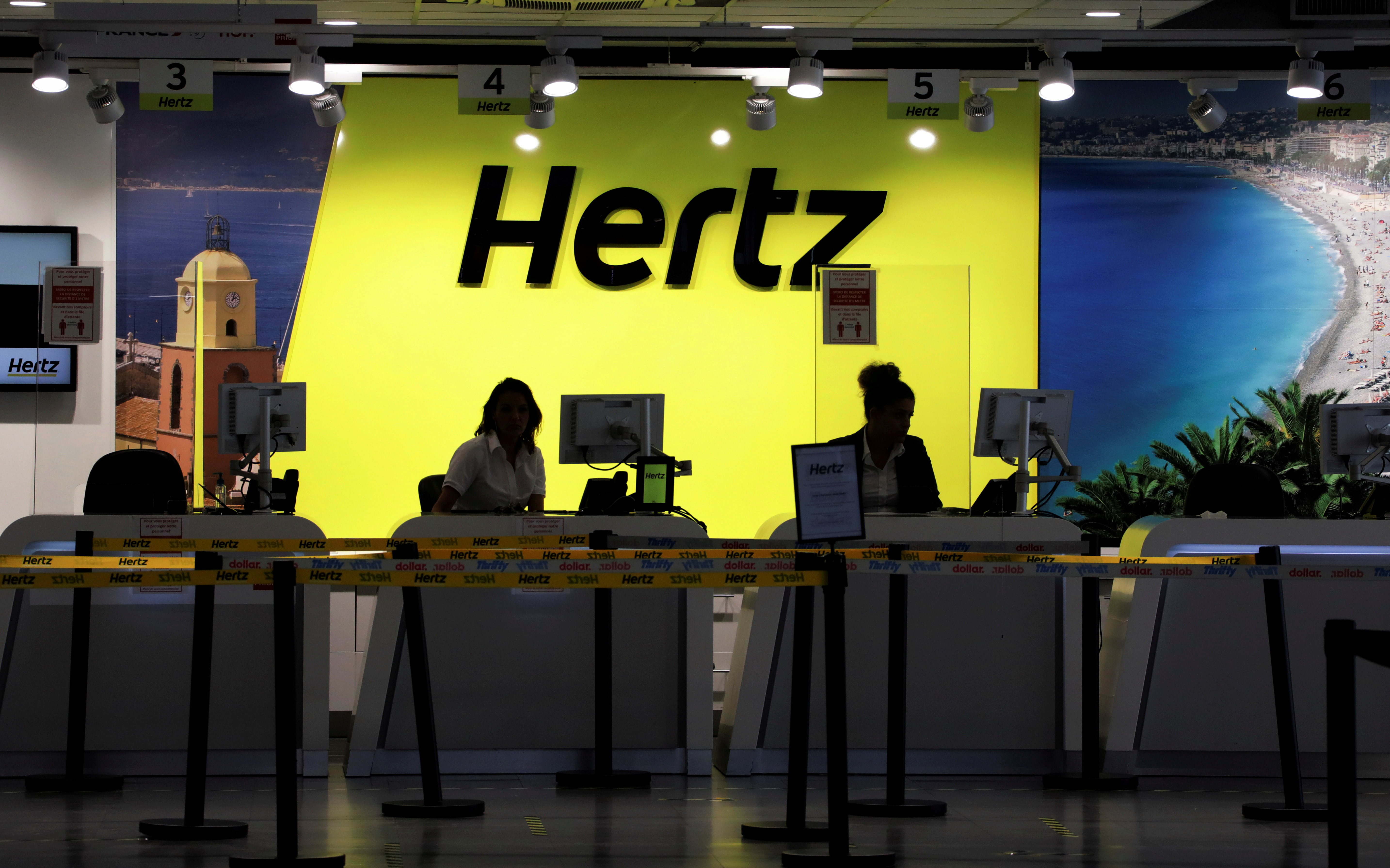 The desk of car rental company Hertz is seen at Nice International airport in Nice, France, May 27, 2020. REUTERS/Eric Gaillard/File Photo