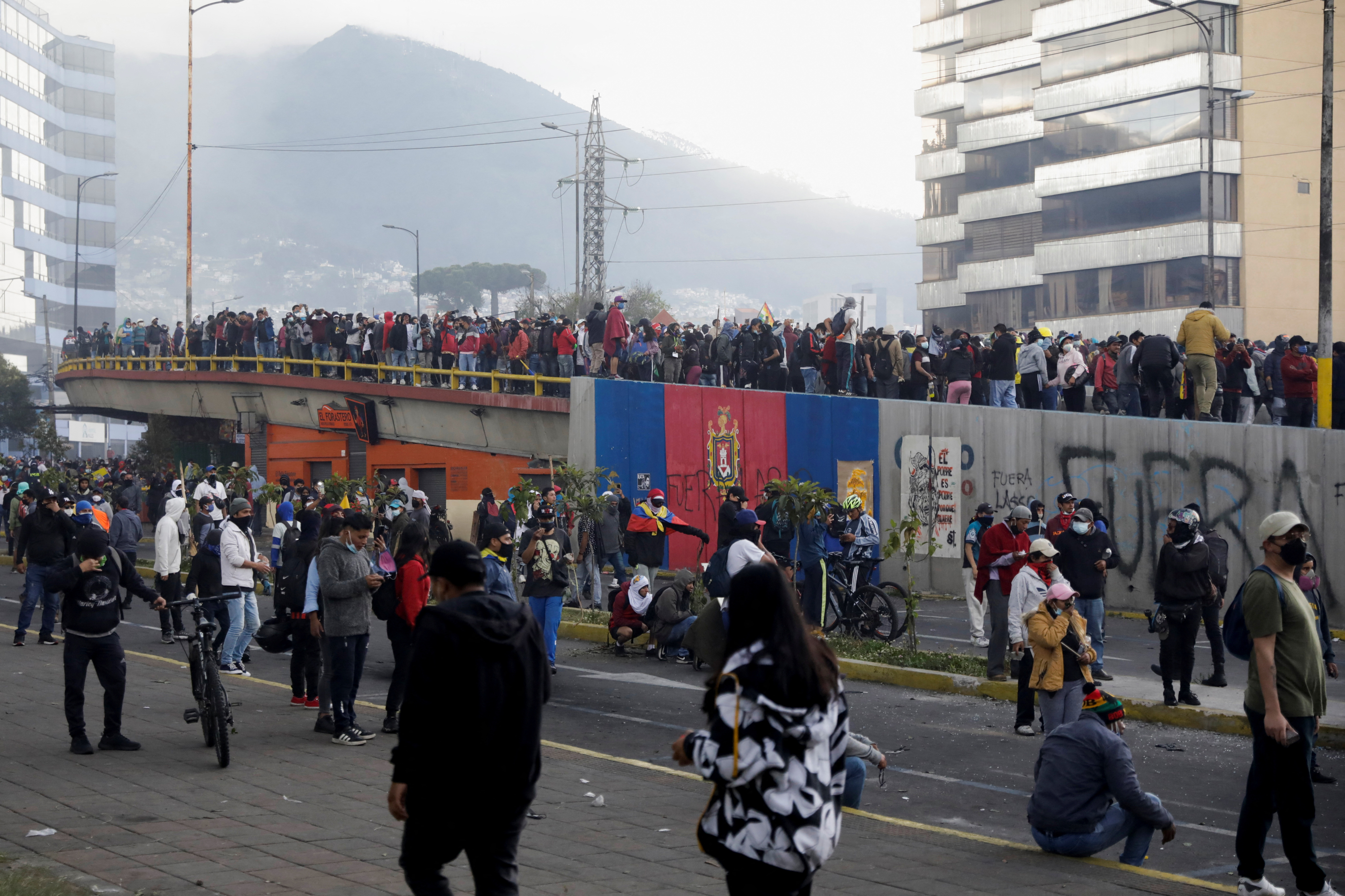 Indigenous protesters march through Quito demanding concessions from President Lasso