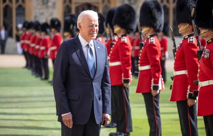 U.S. President Joe Biden inspects a Guard of Honour after arriving to meet Britain's Queen Elizabeth at Windsor Castle, in Windsor, Britain, June 13, 2021. Richard Pohle/Pool via REUTERS