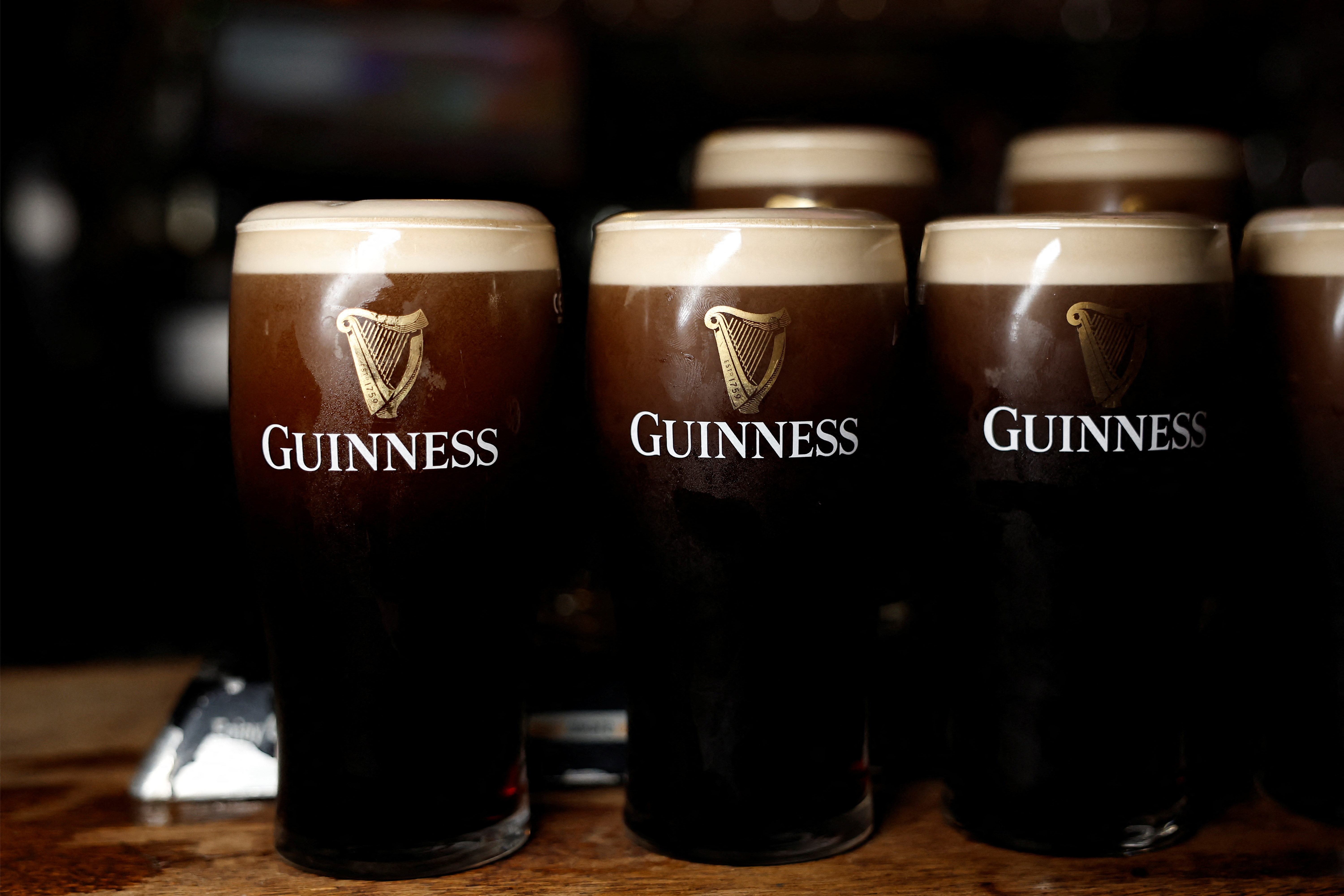 Pints of Guinness are seen in a pub, in Dublin