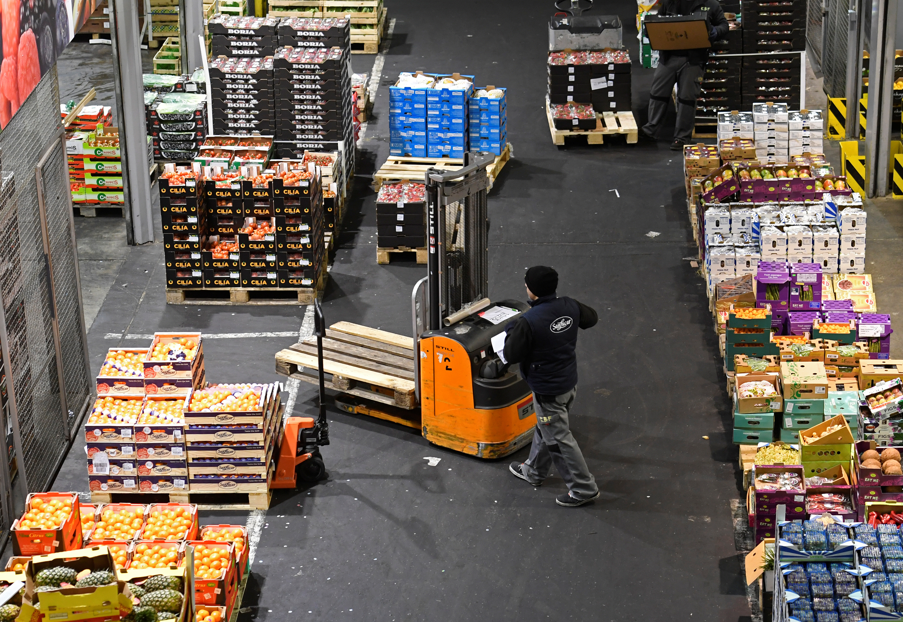 A worker is seen at the wholesale fruits and vegetables market in Hamburg