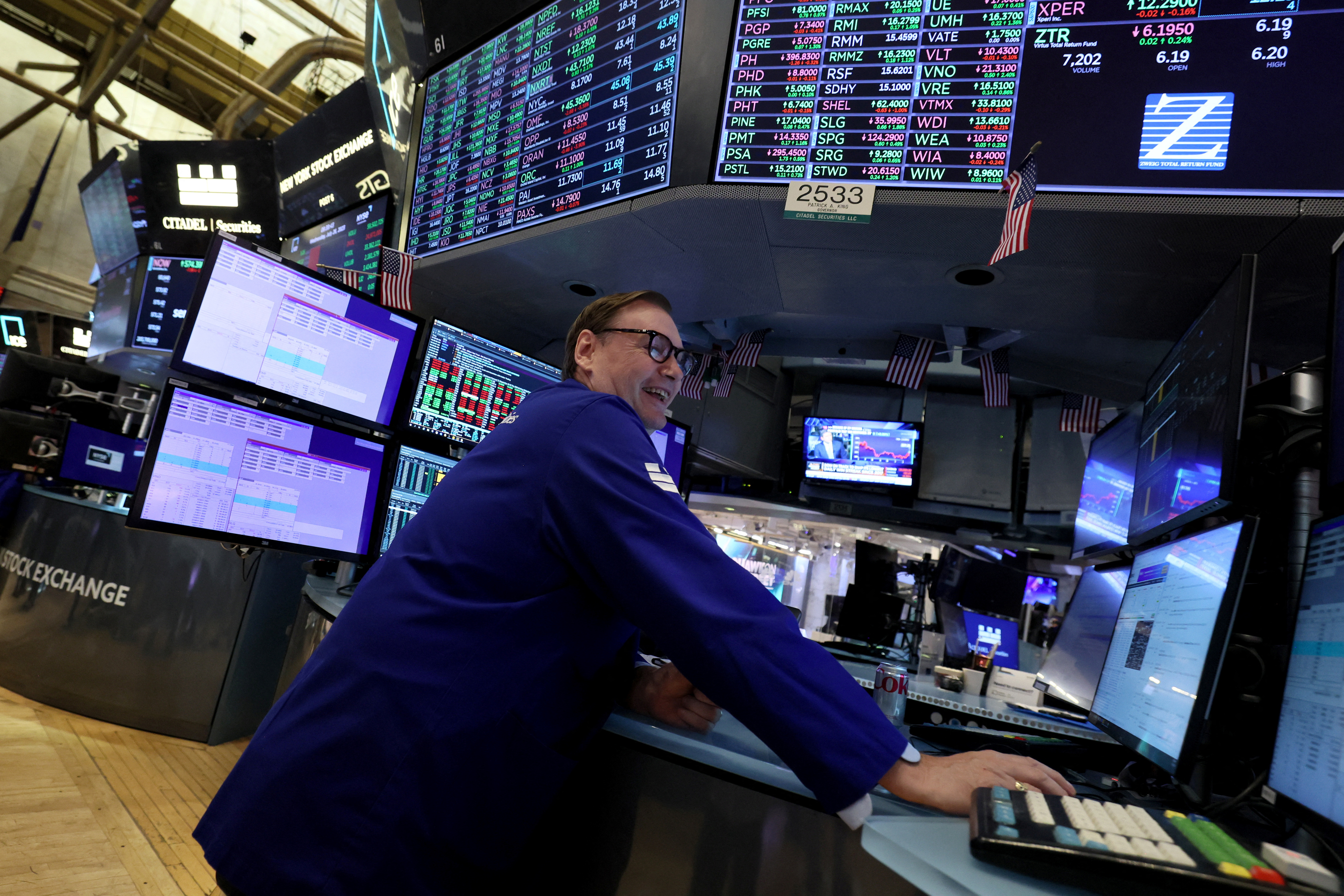 Traders work on the floor of the NYSE in New York