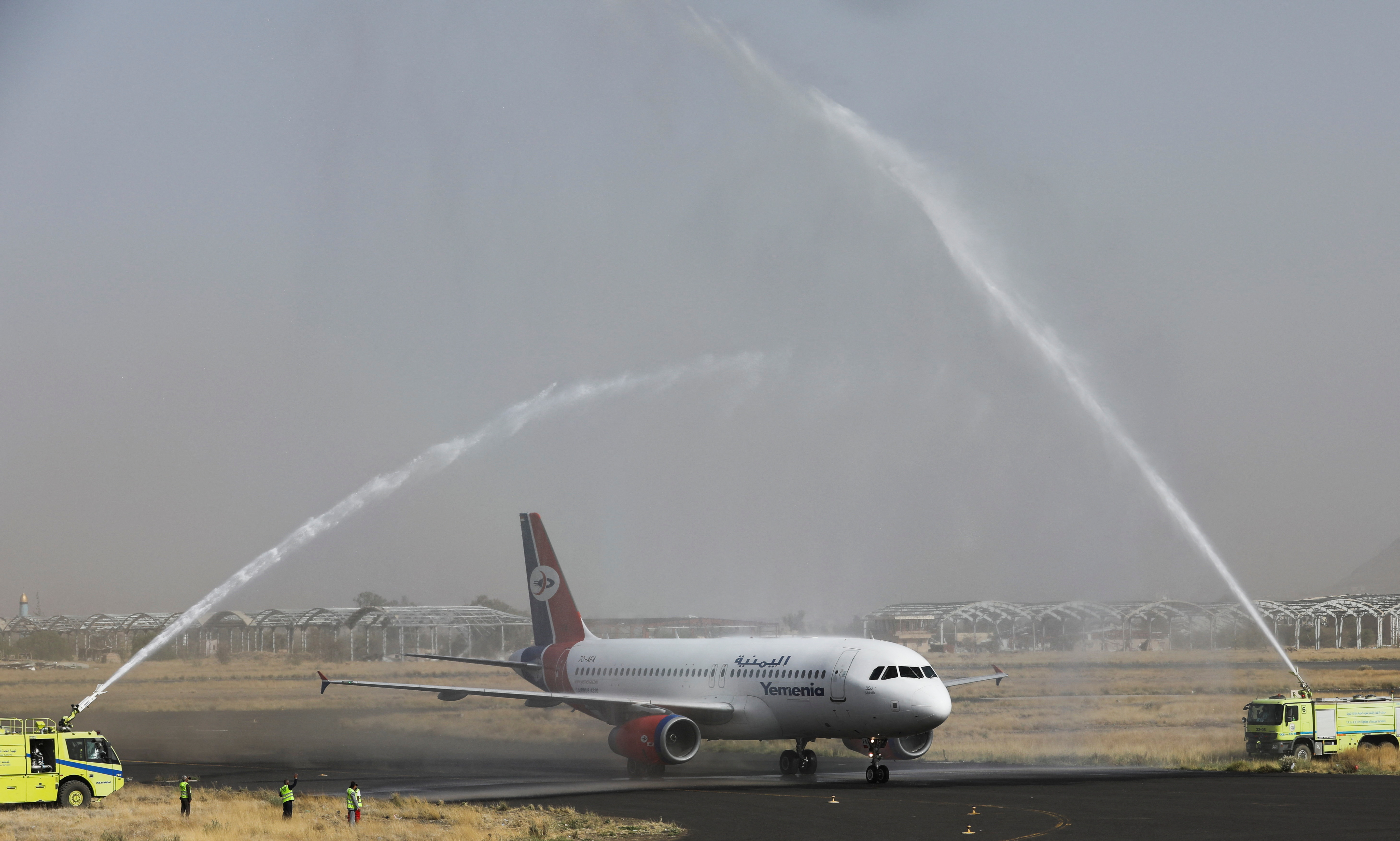 Yemen Airways plane is greeted with water canon salute at Sanaa Airport as the first commercial flight in around six years, in Sanaa
