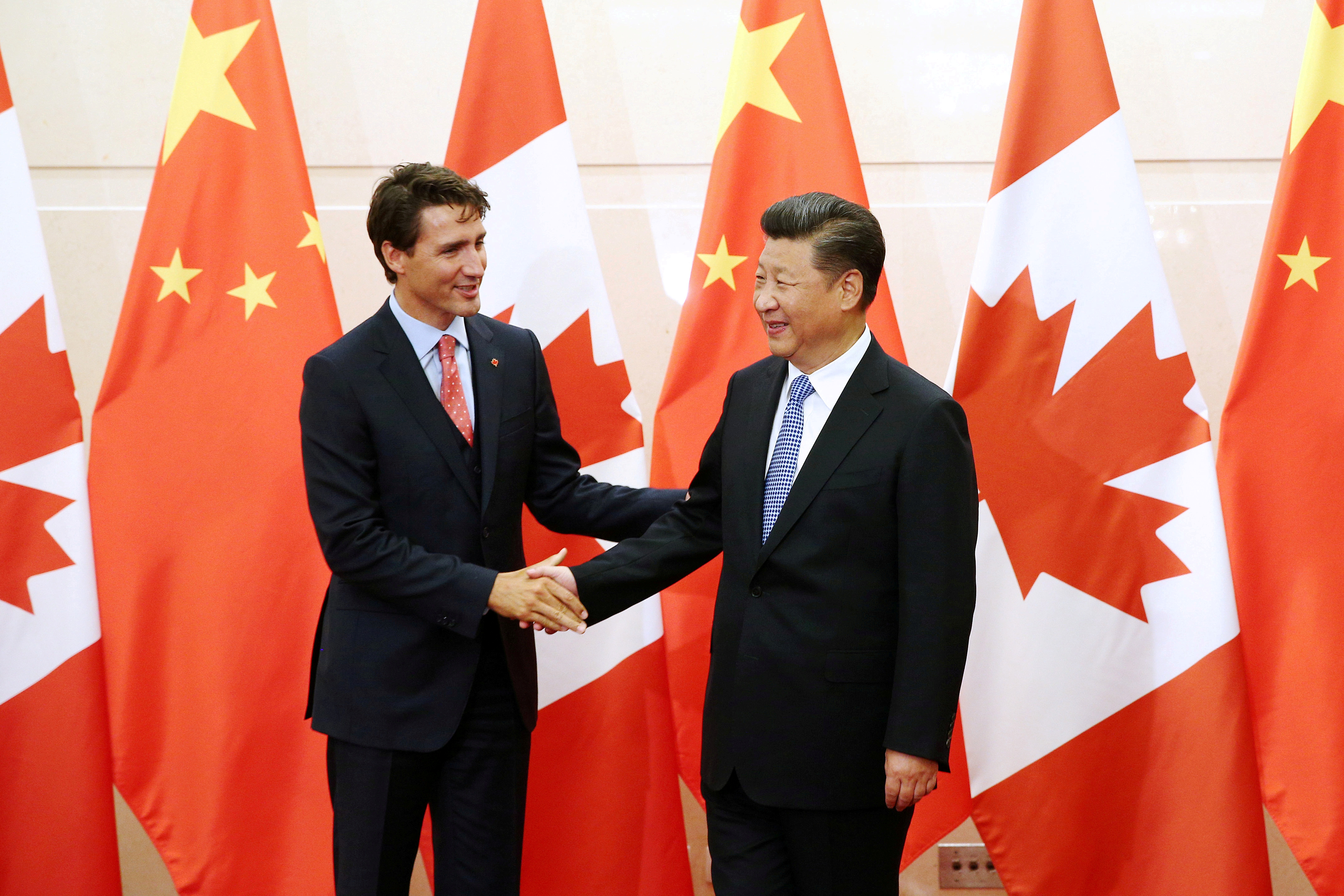 Chinese President Xi Jinping shakes hands with Canadian Prime Minister Trudeau ahead of their meeting at the Diaoyutai State Guesthouse in Beijing