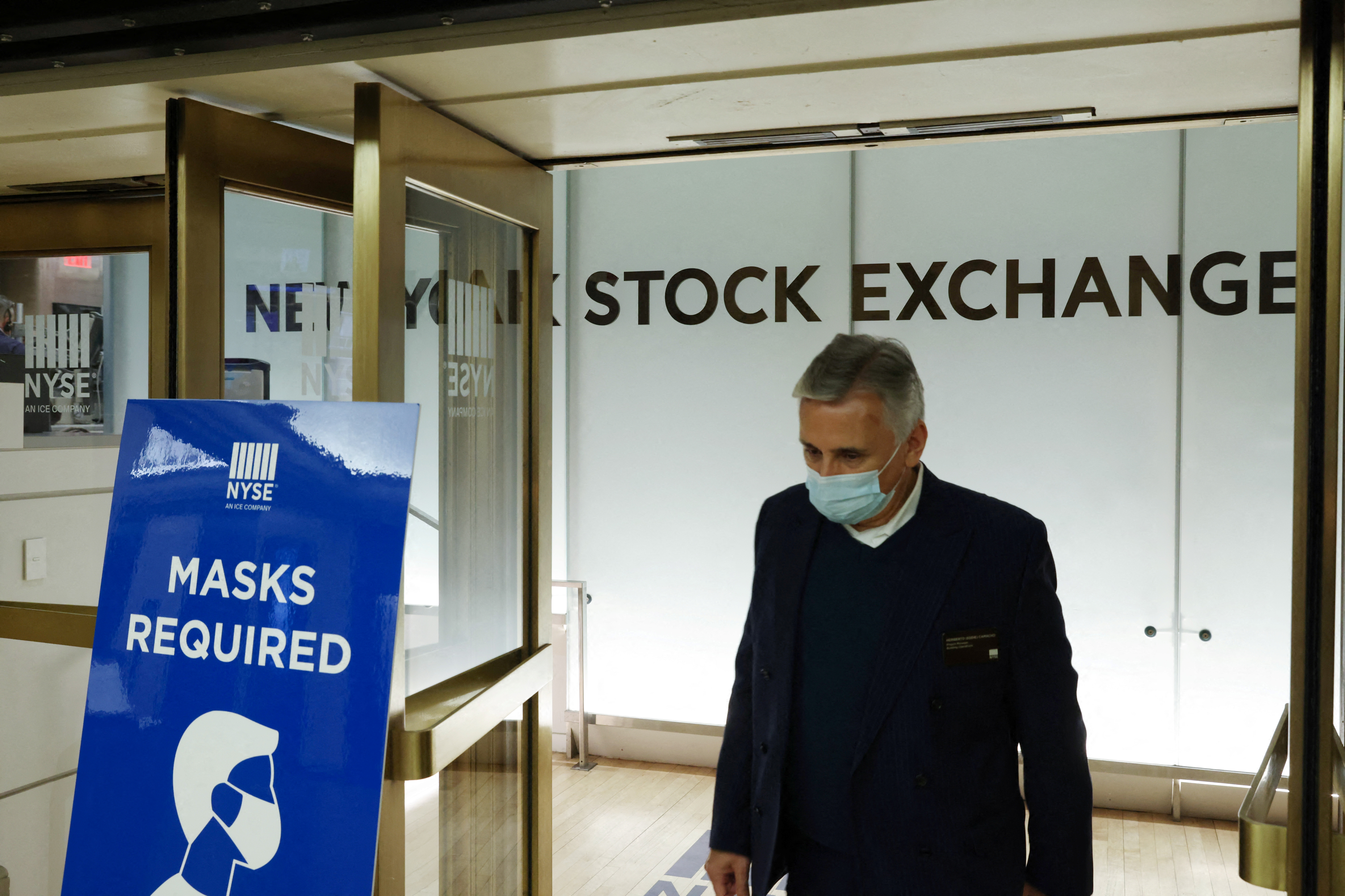 Signage is seen directing people to wear face masks at the New York Stock Exchange (NYSE) in New York City