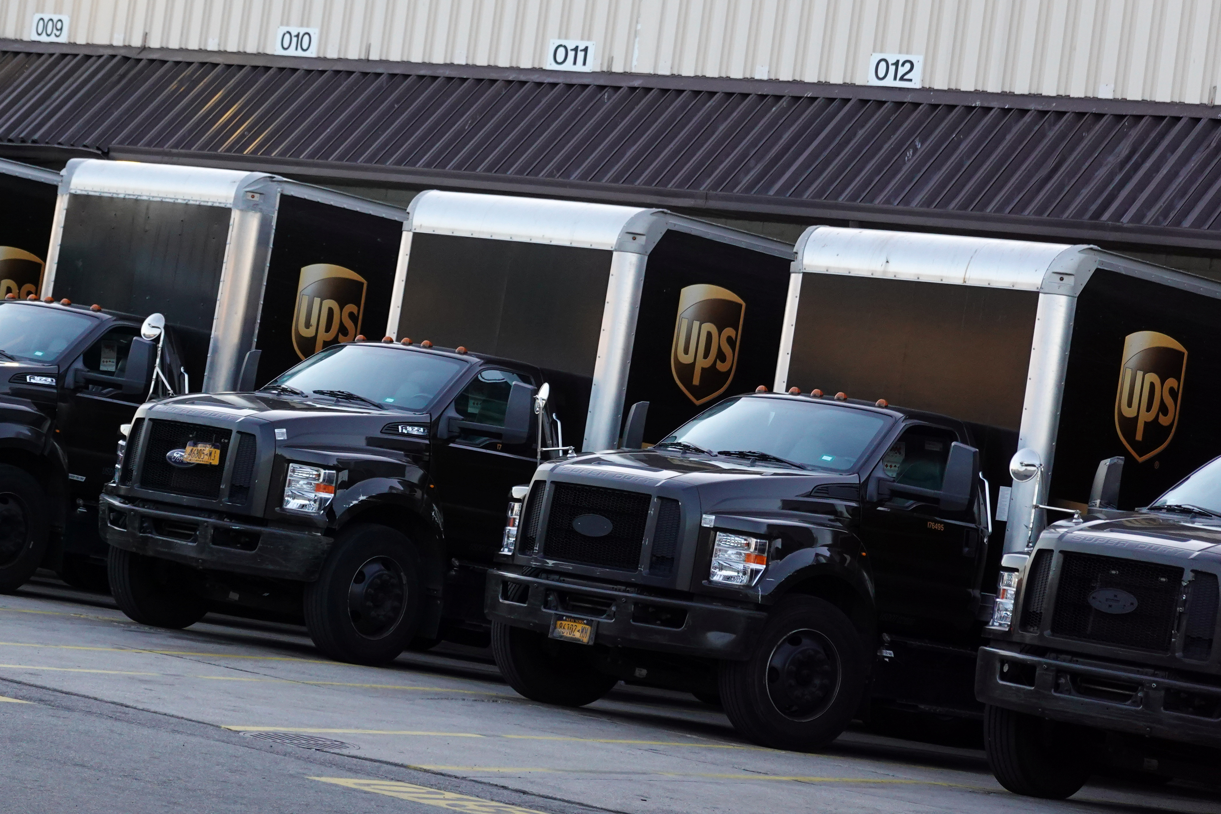 United Parcel Service (UPS) vehicles are seen at a facility in Brooklyn, New York City