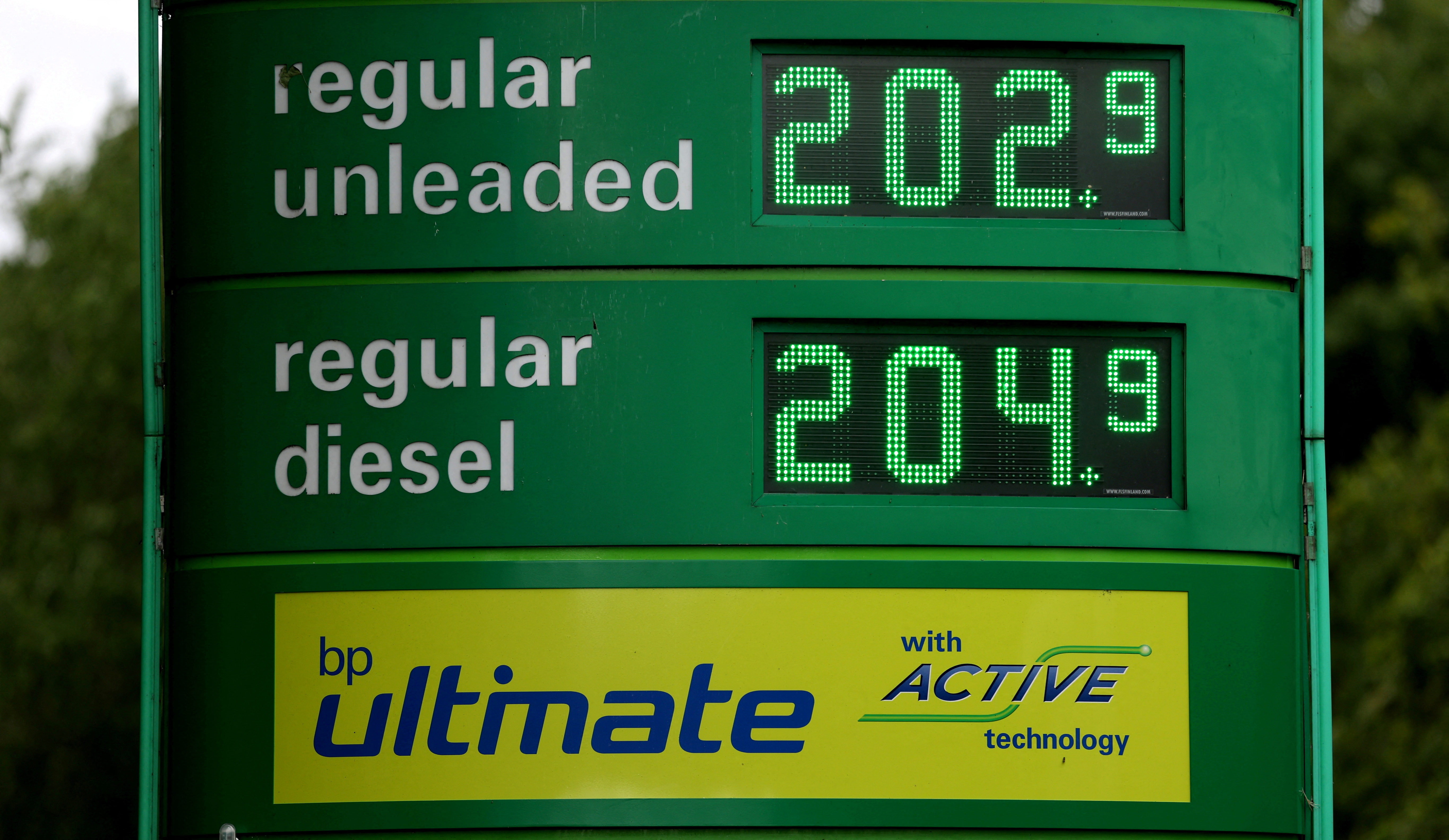 Increased petrol and diesel are seen on a display board at a filling station in Stafford
