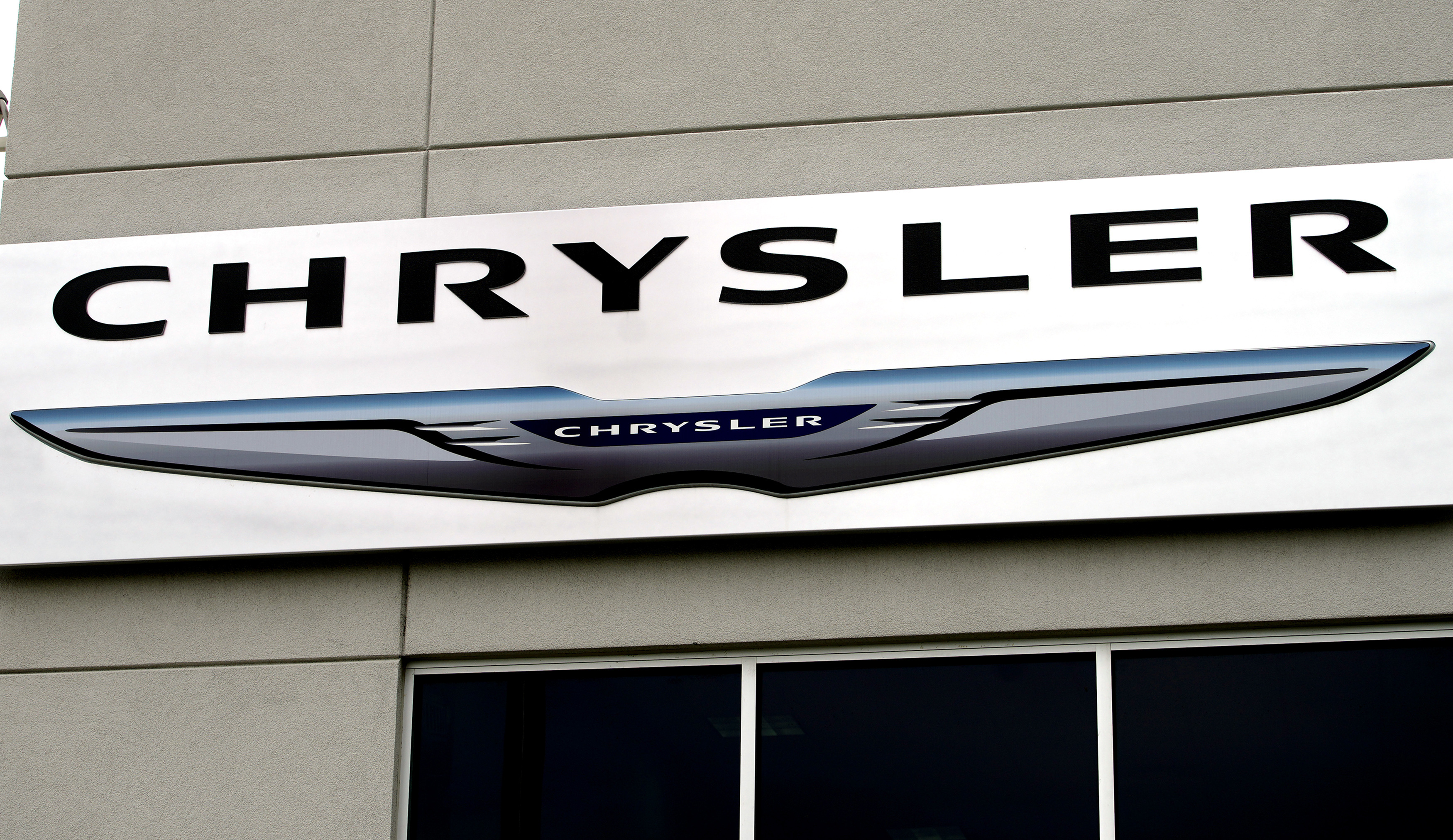 The Chrysler logo is seen outside the Chrysler auto dealer in Broomfield, Colorado