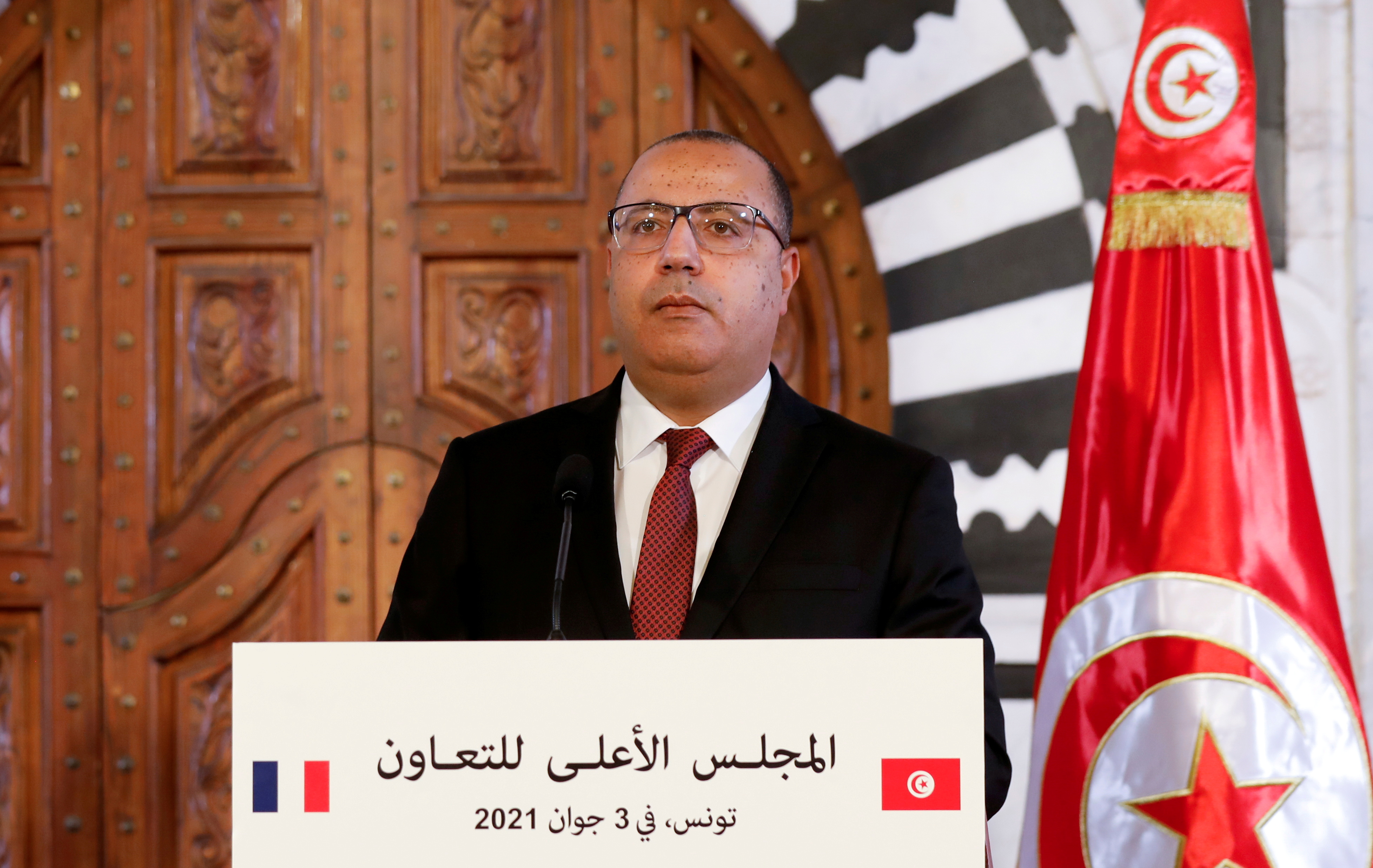 Tunisian prime minister appears in news conference