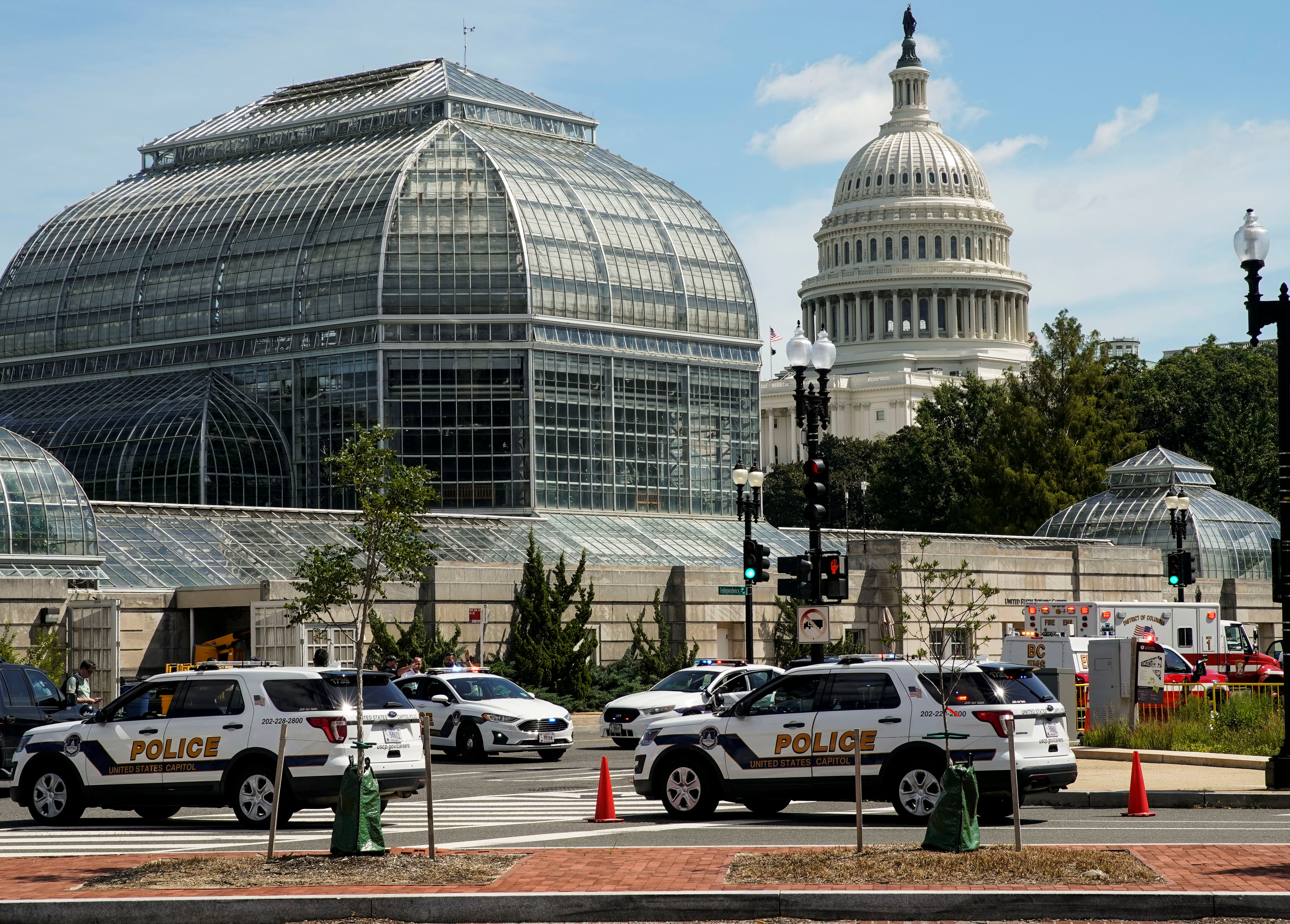 U.S. Capitol Police vehicles and other emergency vehicles respond as police investigated reports of a suspicious vehicle near the U.S. Capitol in Washington, U.S., August 19, 2021. REUTERS/Elizabeth Frantz