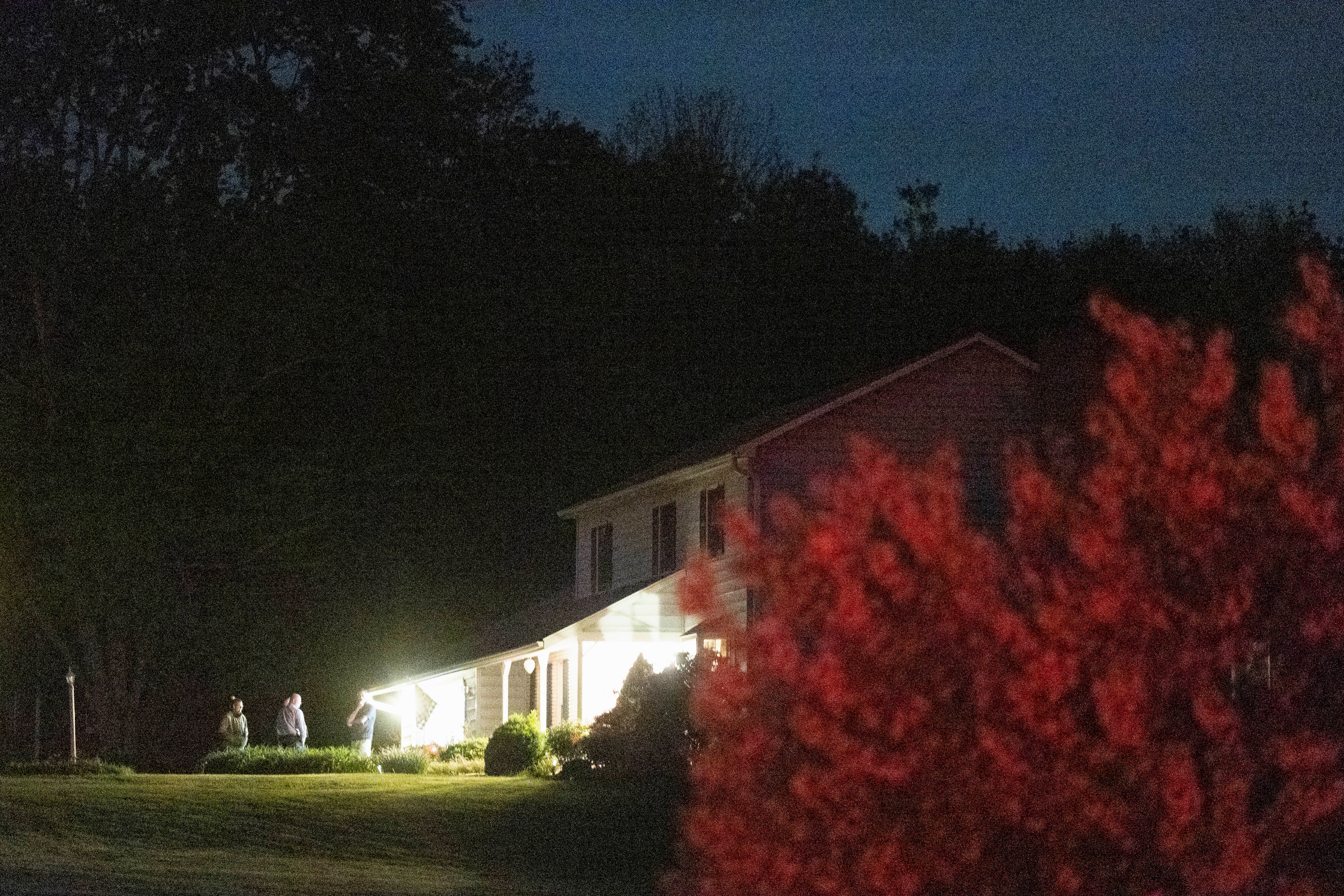 Law enforcement personnel are seen at the home of Buffalo supermarket shooting suspect, in Conklin