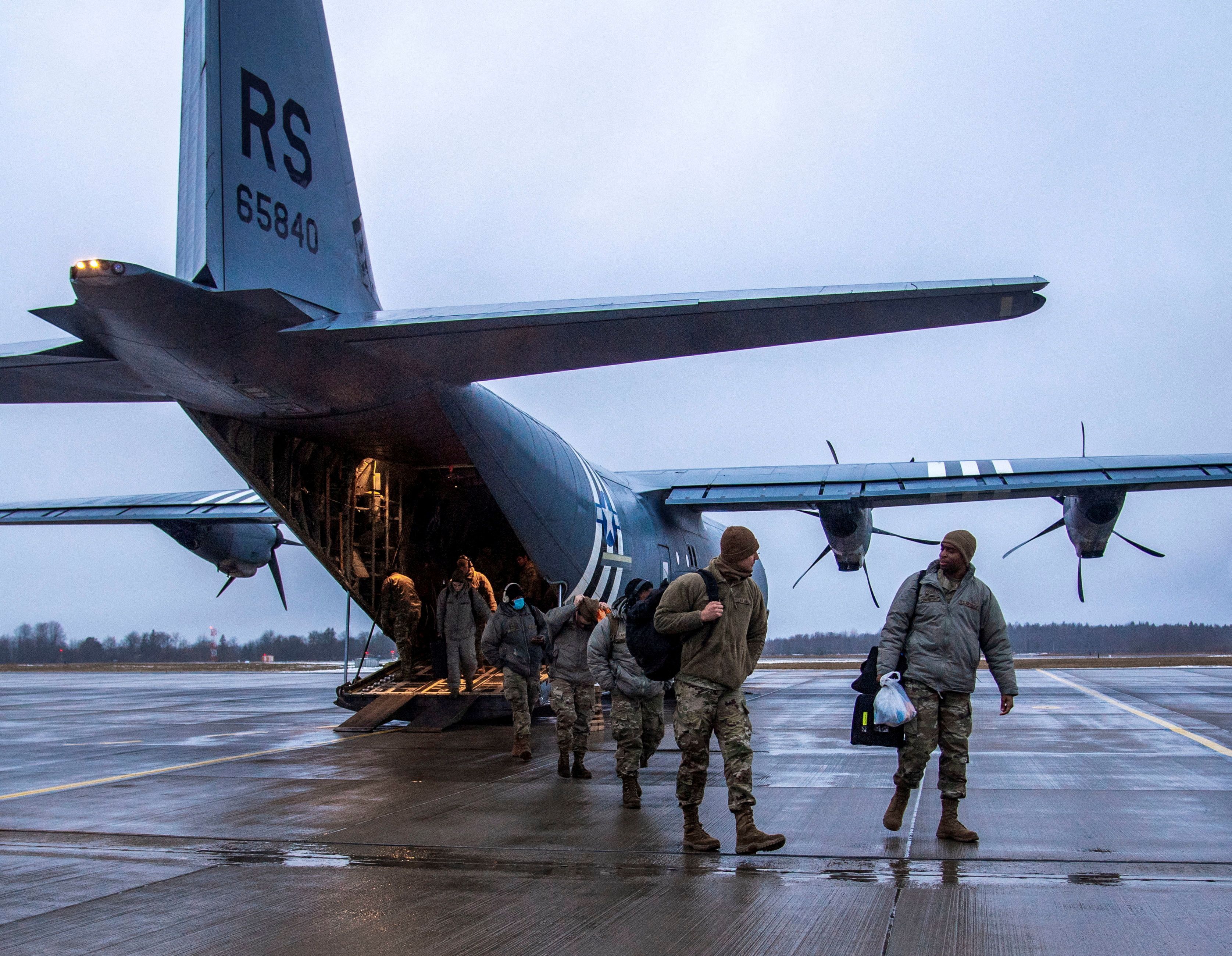 Airmen from the 4th Fighter Wing at Seymour Johnson Air Force Base, N.C. and the 48th Fighter Wing, Royal Air Force Lakenheath, England, arrive at Amari Air Base, Estonia, January 24, 2022. U.S. Air Force Photo/Staff Sgt. Megan Beatty/Handout via REUTERS 