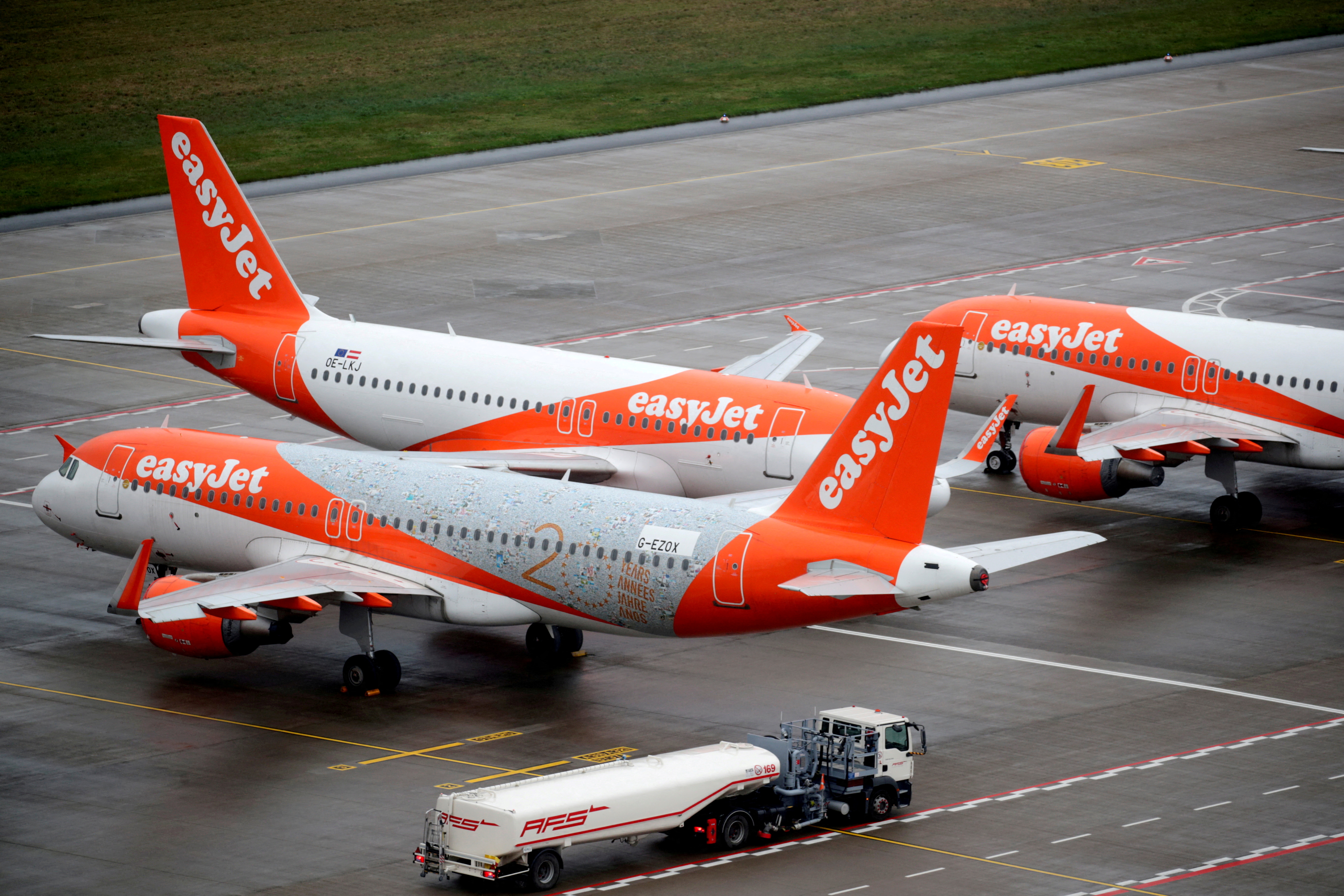 EasyJet airplanes are parked on the tarmac at Berlin-Brandenburg Airport (BER) 