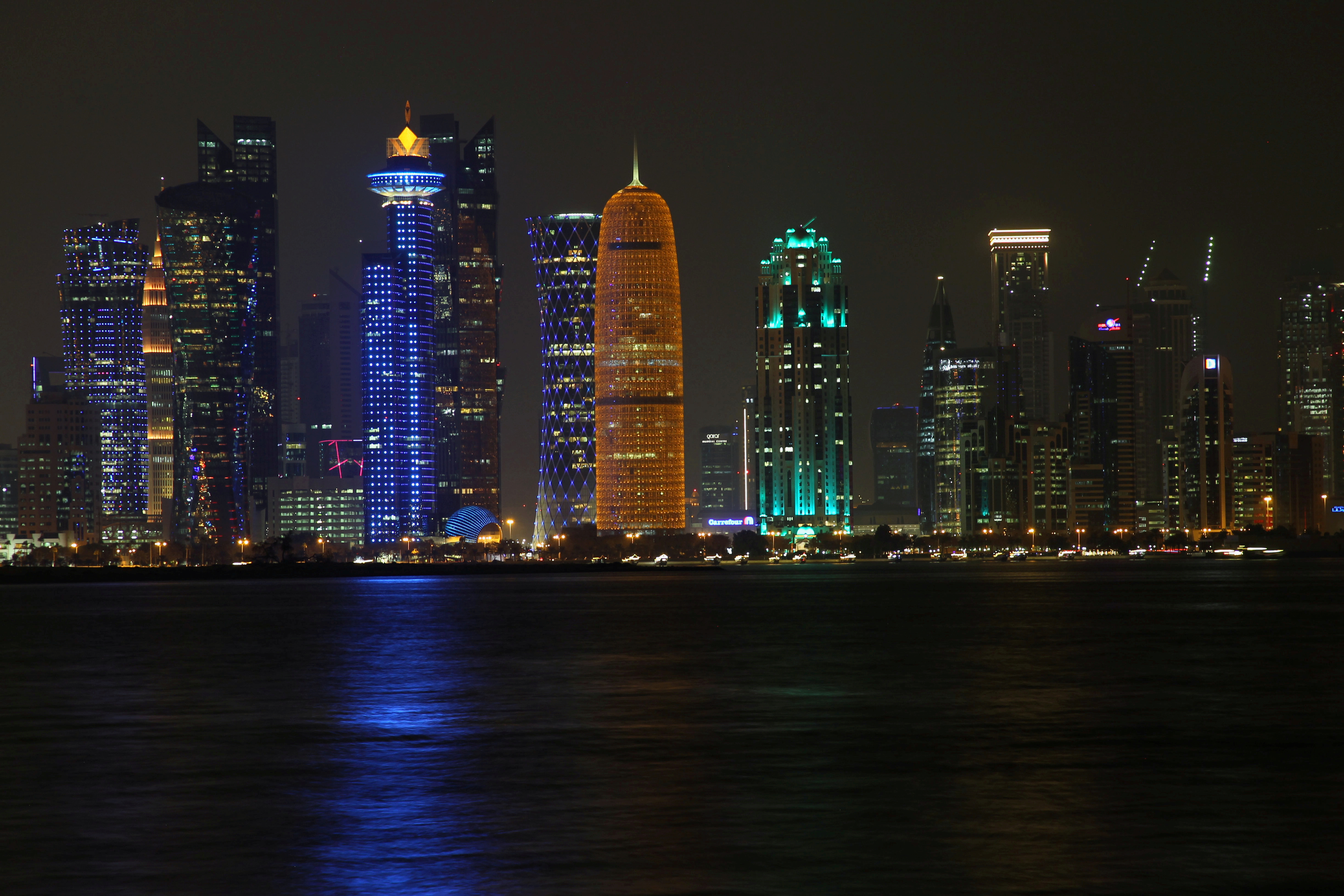 Night scene of the skyline of Doha with towers are seen at Al Dafna Area in Doha