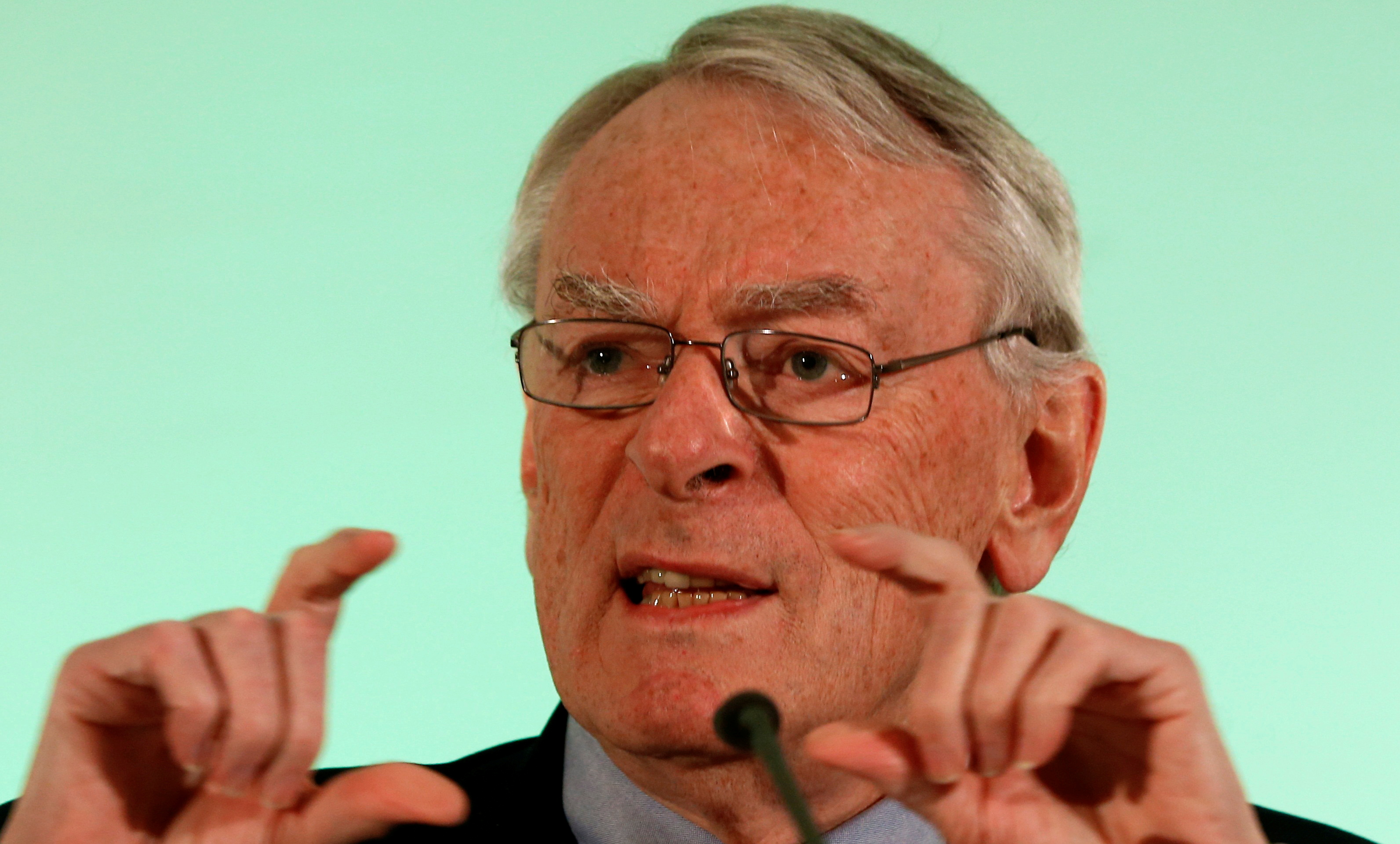 WADA former president, Pound, who heads the commission into corruption and doping in athletics, gestures at a news conference in Unterschleissheim