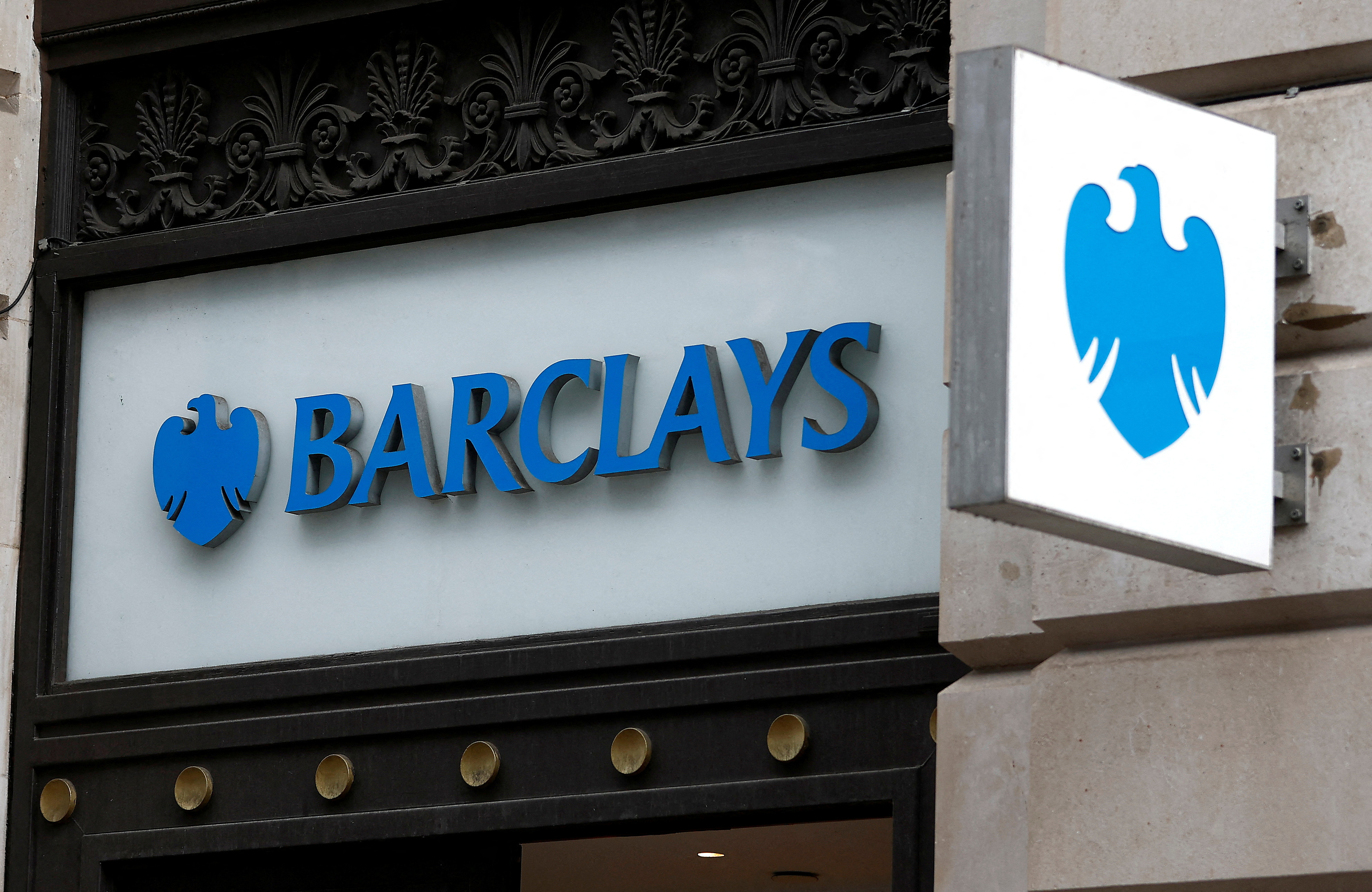 A view shows signage at a branch of Barclays Bank in London