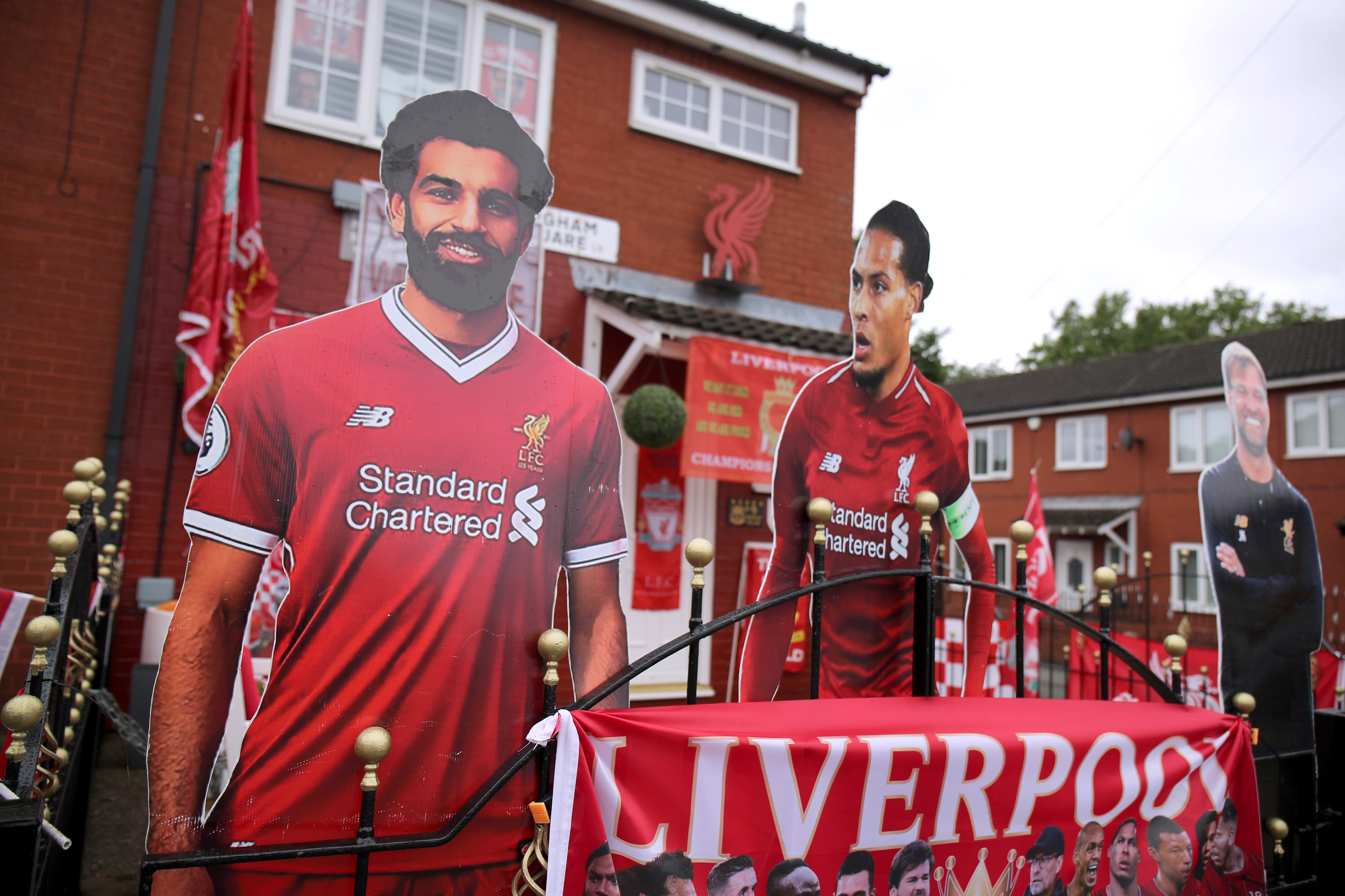 Soccer Football - Return of the Premier League - Everton v Liverpool Preview - Liverpool, Britain - June 19, 2020  Cutout photos of Liverpool's Mohamed Salah, Virgil van Dijk and Liverpool manager Juergen Klopp are seen outside the house of Emily Farley, who has decorated it in memory of her husband David ahead of the match.  Action Images via Reuters/Molly Darlington