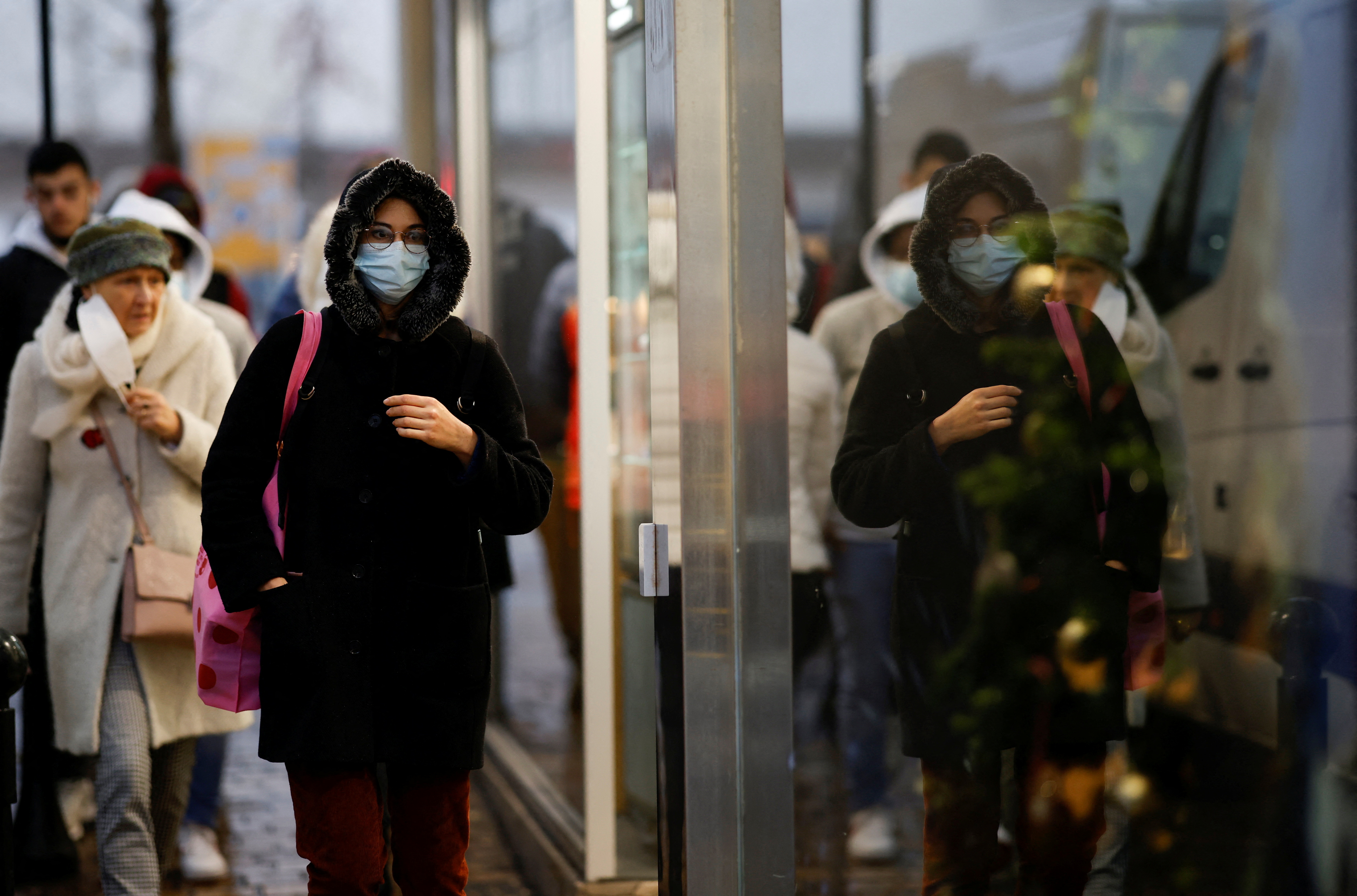 People wearing face masks walk in Nantes amid the coronavirus disease (COVID-19) outbreak in France, December 9, 2021. REUTERS/Stephane Mahe