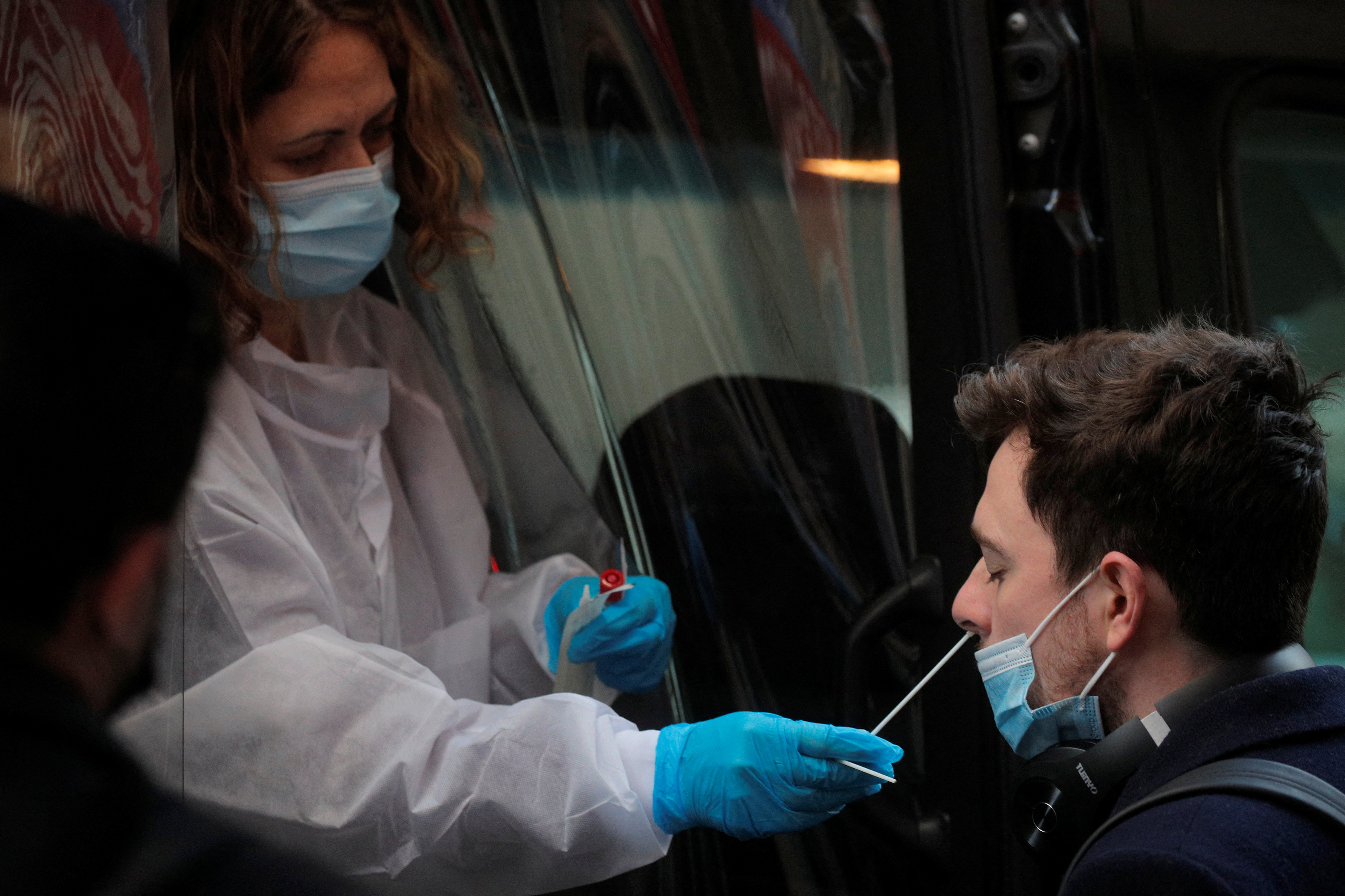 A man takes a coronavirus disease (COVID-19) test at pop-up testing site in New York