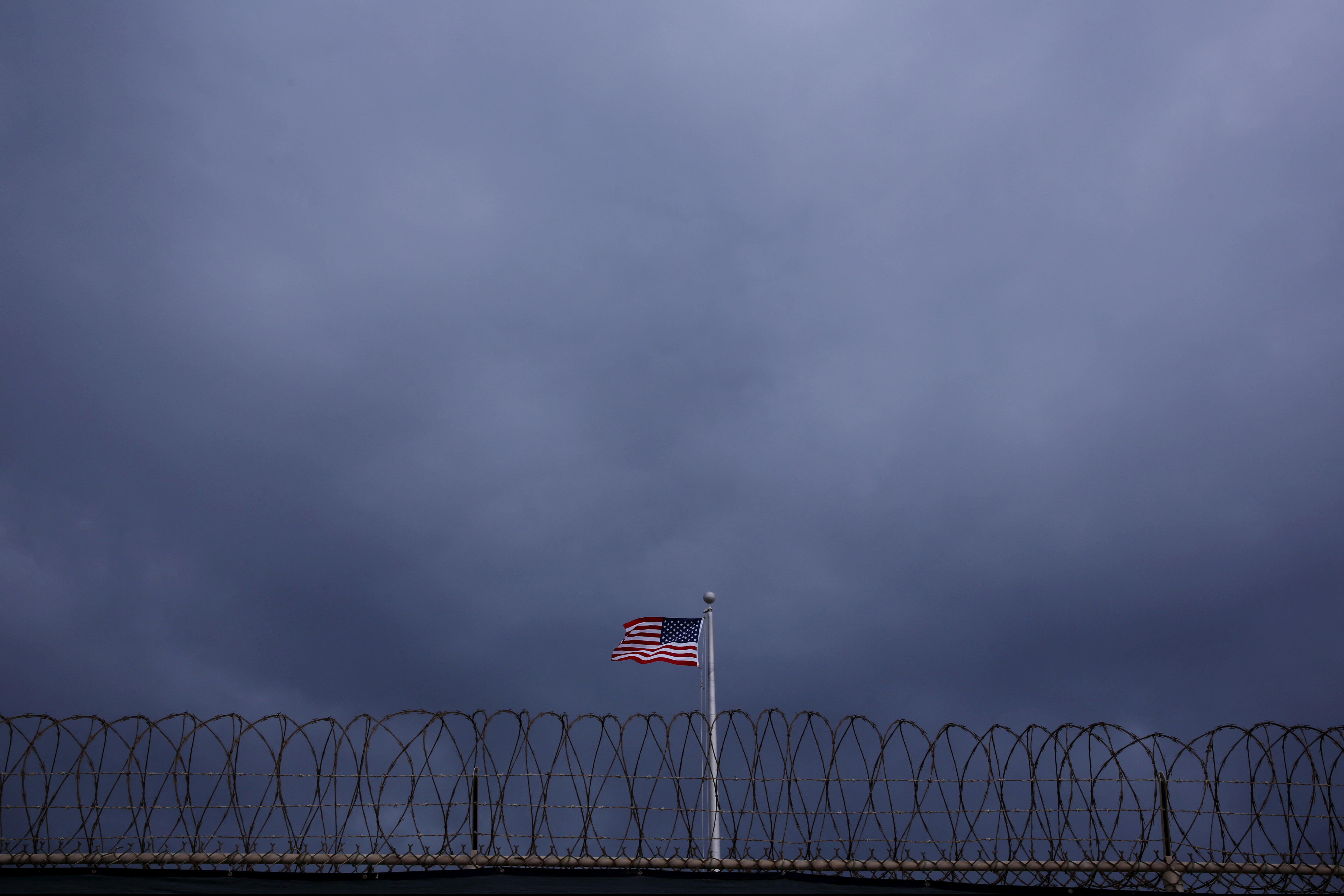 The United States flag flies inside of Joint Task Force Guantanamo Camp VI at the U.S. Naval Base in Guantanamo Bay, Cuba