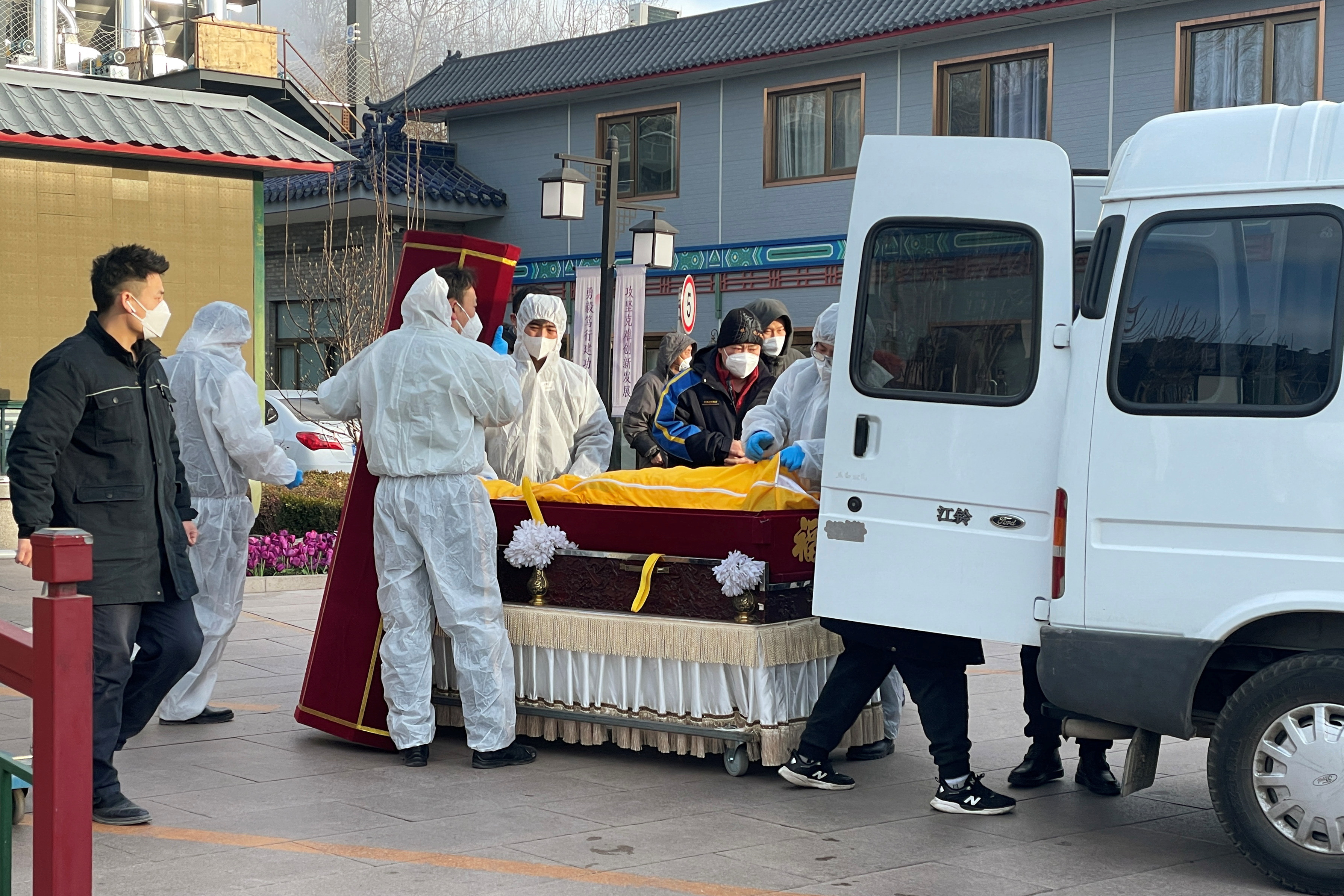 Workers at a funeral home in Beijing