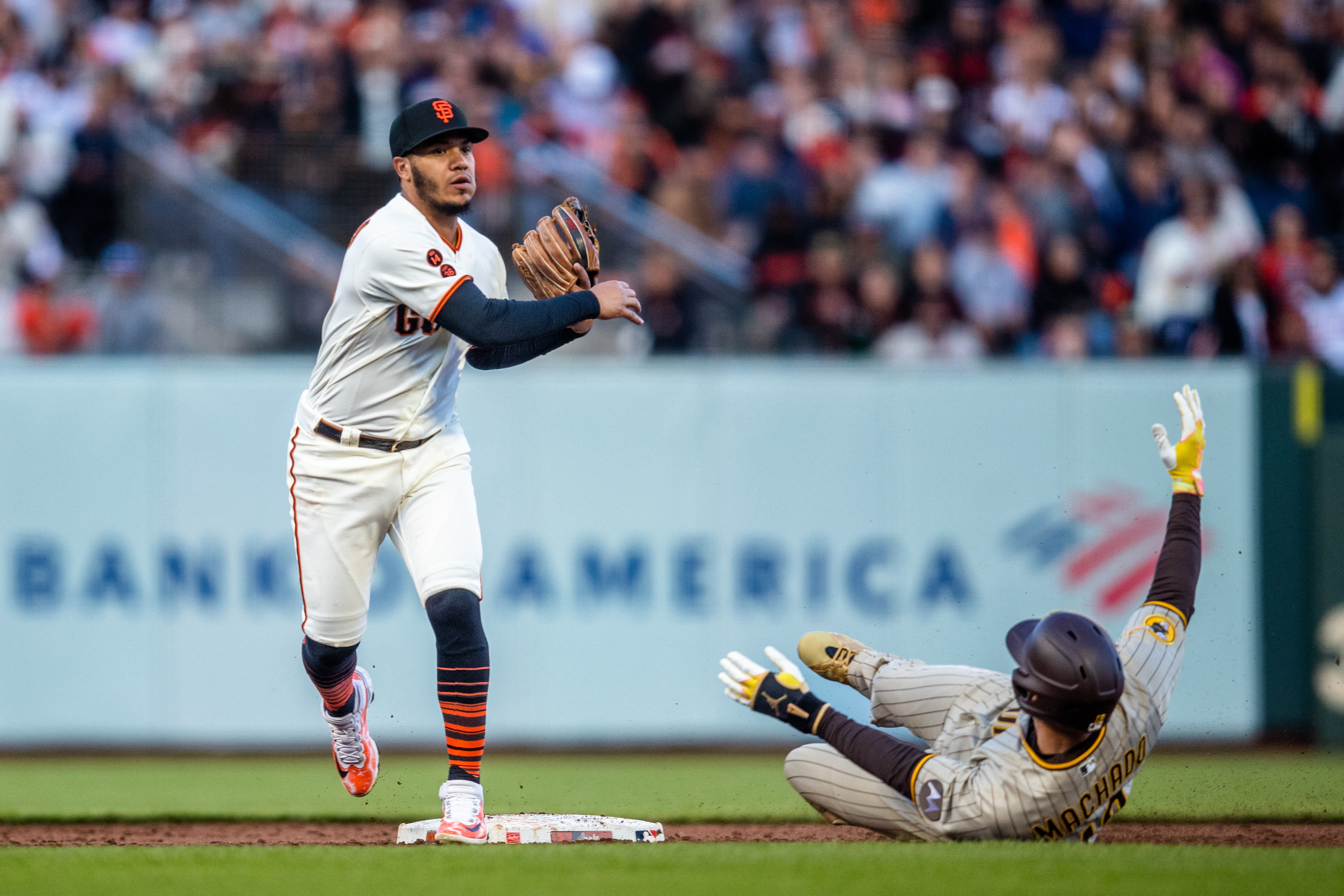 San Diego Padres' Jake Cronenworth (9) celebrates with Rougned Odor after  they scored on a two-run single hit by Ha-Seong Kim during the fourth  inning of a baseball game against the San