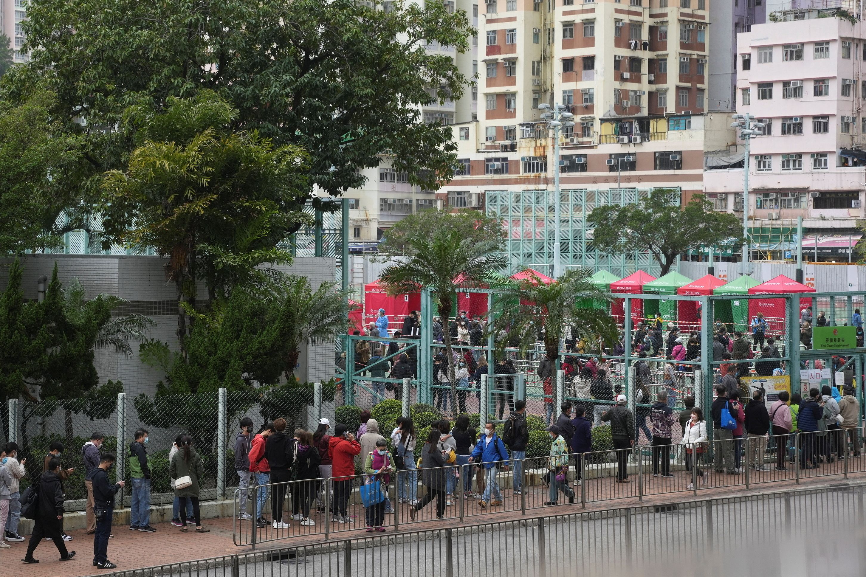 People queue outside a makeshift testing centre for the coronavirus disease (COVID-19) following the outbreak, in Hong Kong