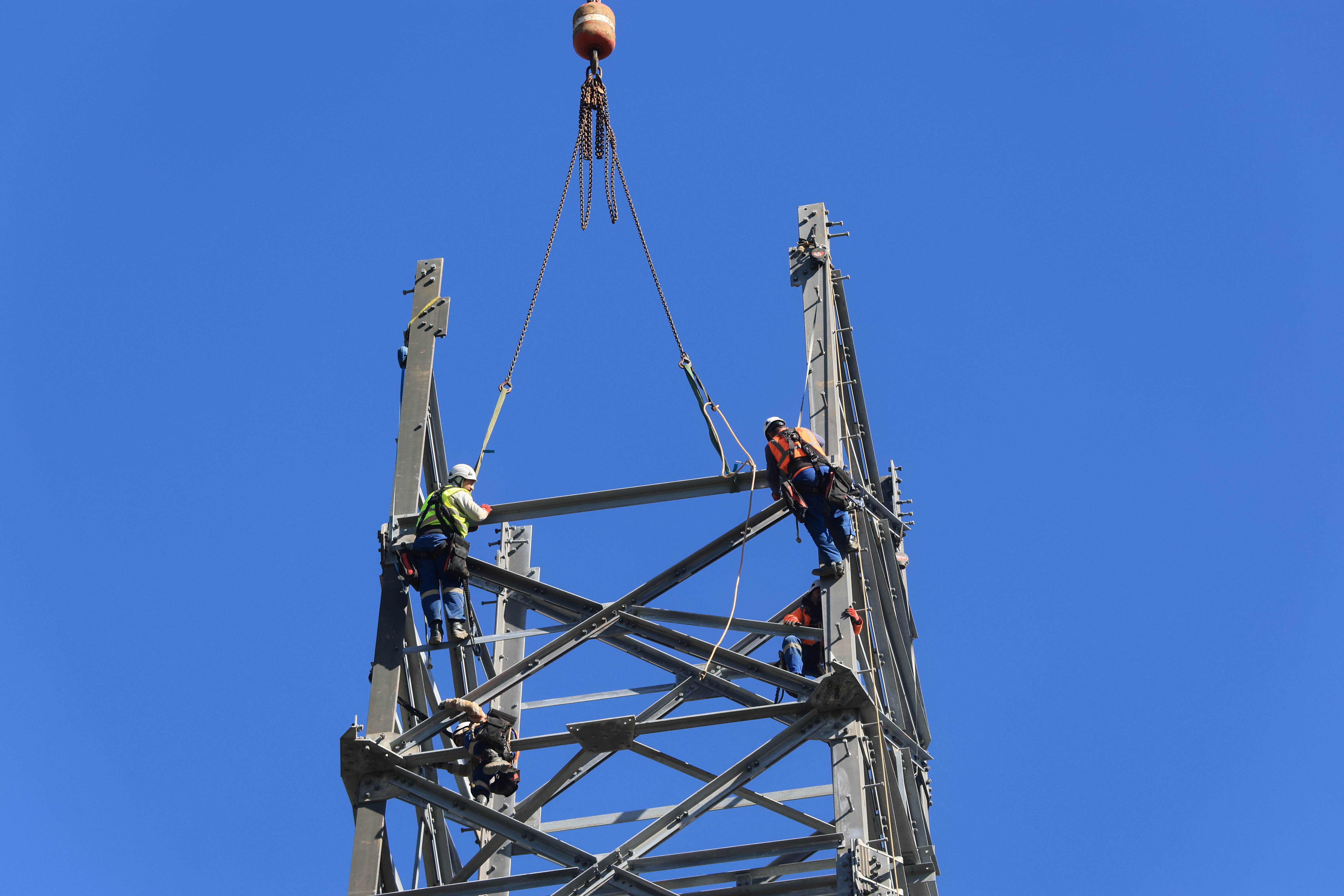 Workers set up a high-voltage power line for Amprion near Duesseldorf