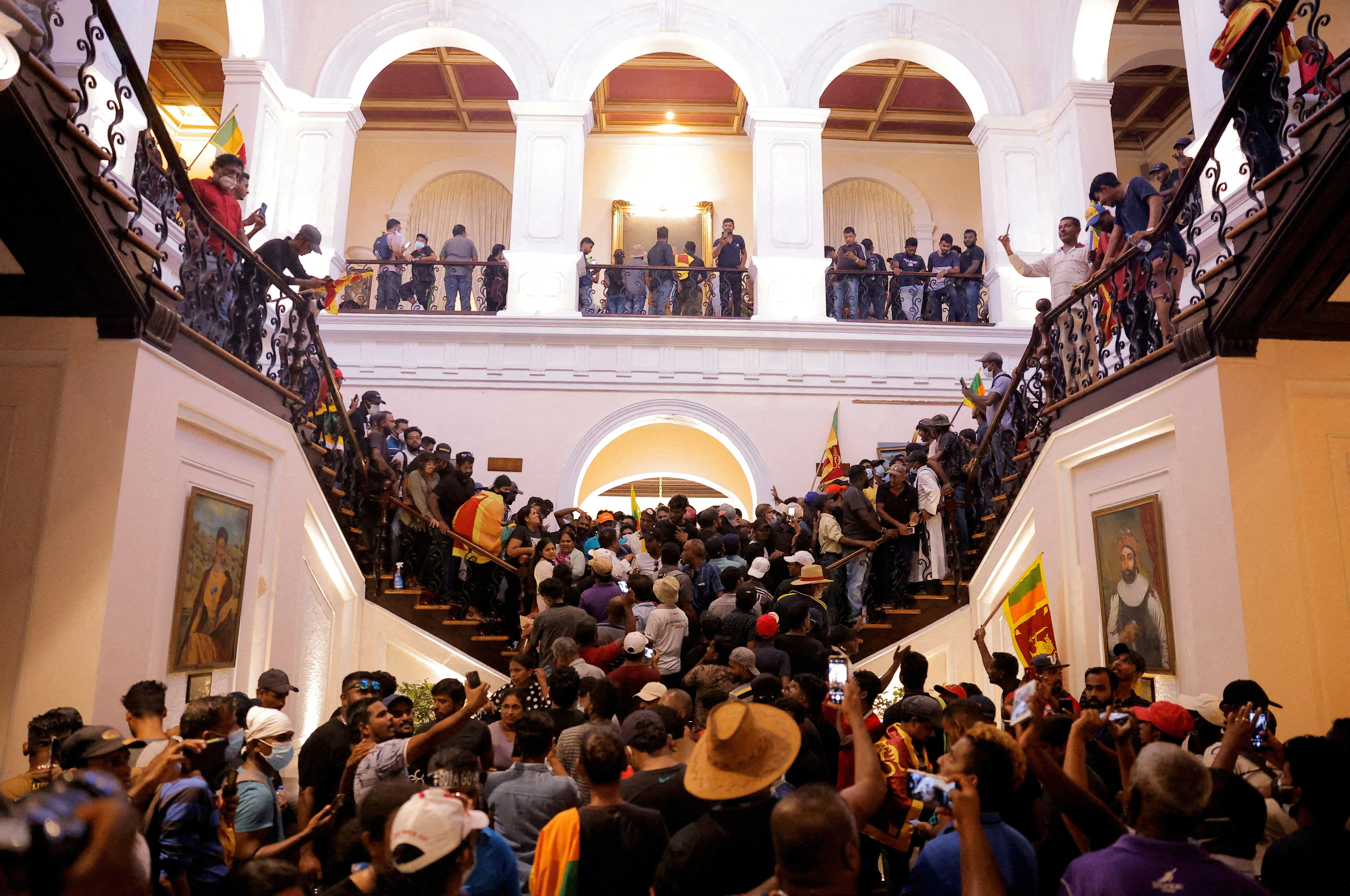  Demonstrators protest inside the President's House, after President Gotabaya Rajapaksa fled, amid the country's economic crisis, in Colombo, Sri Lanka, July 9, 2022. REUTERS/Dinuka Liyanawatte/File Photo