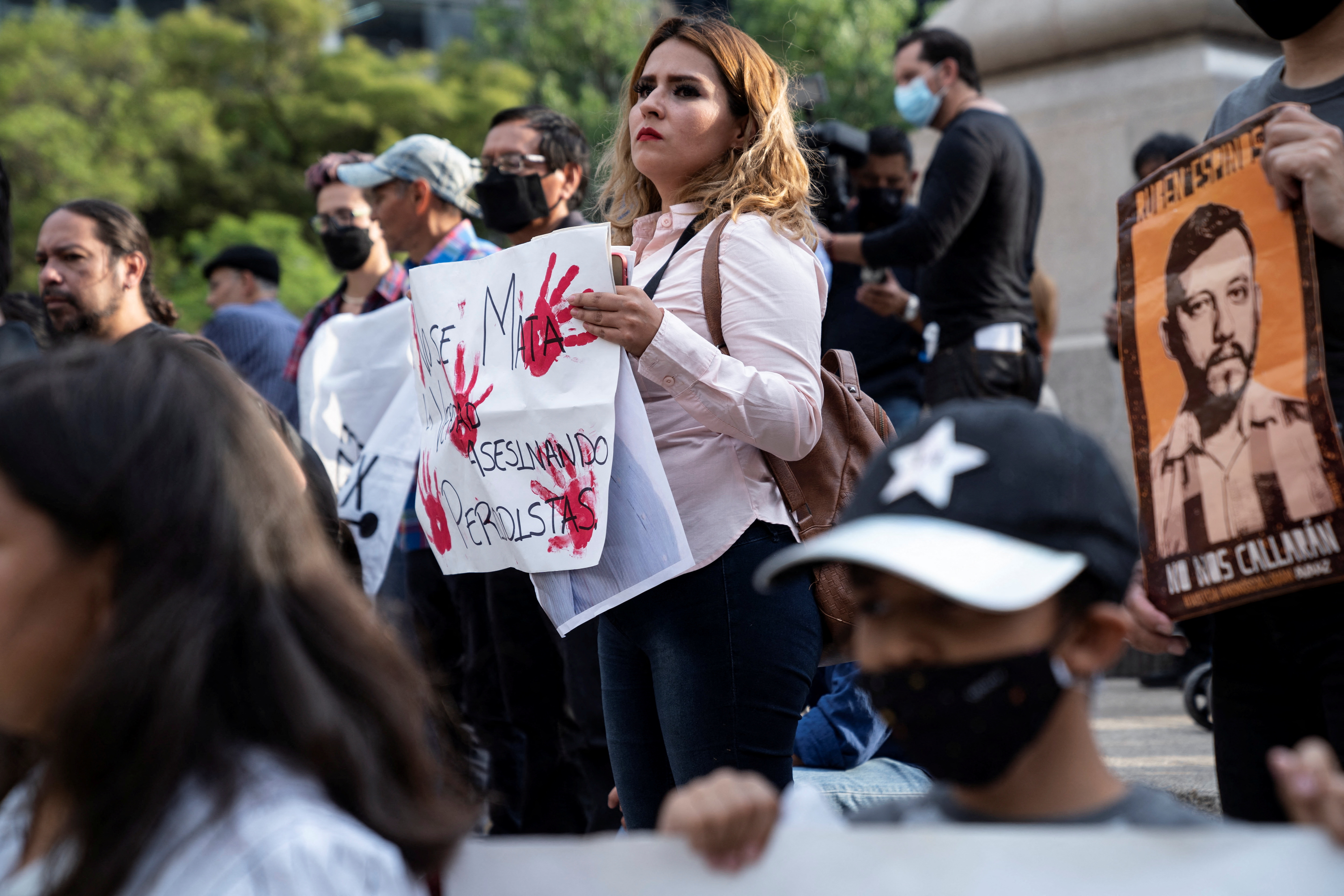 People take part in a protest after a Mexican journalist was found dead in Sinaloa, in Mexico City