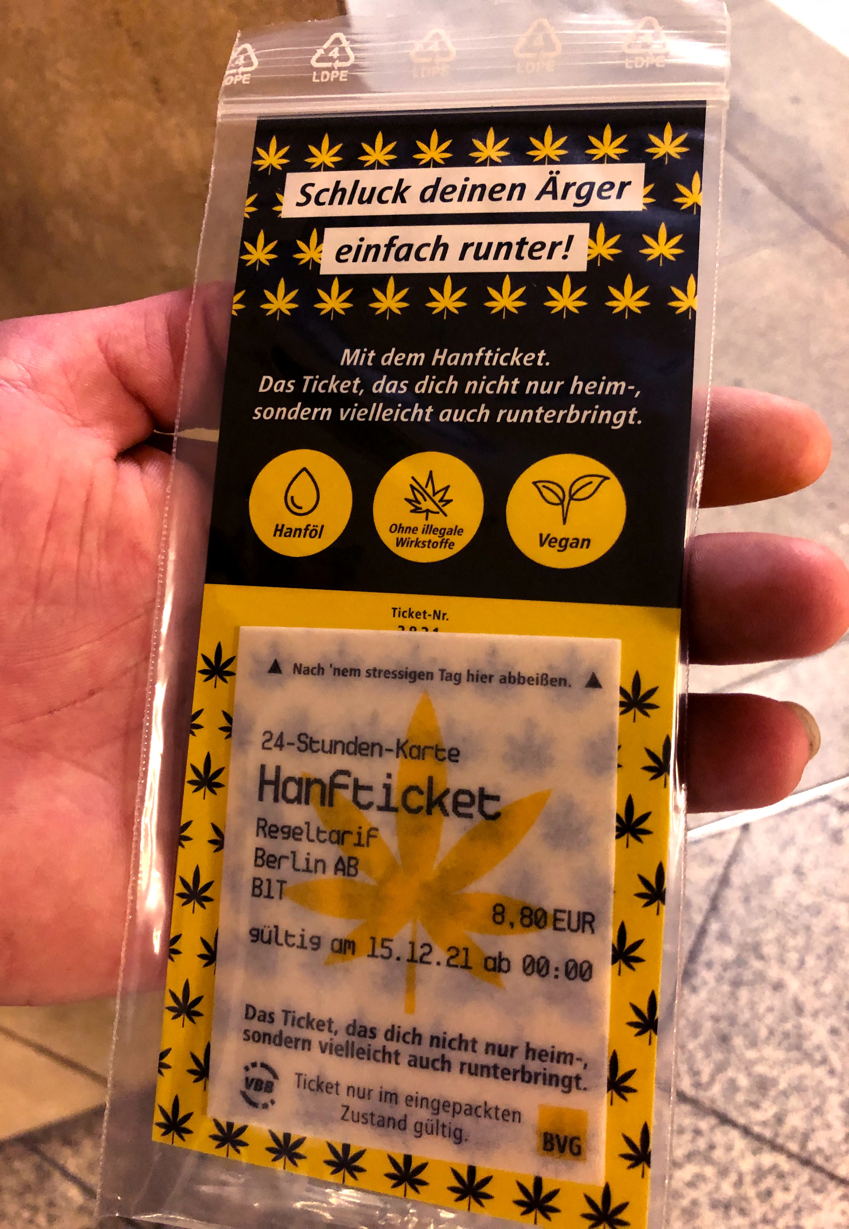 A person holds one of a few thousand limited BVG edible cannabis rice paper train tickets in Berlin