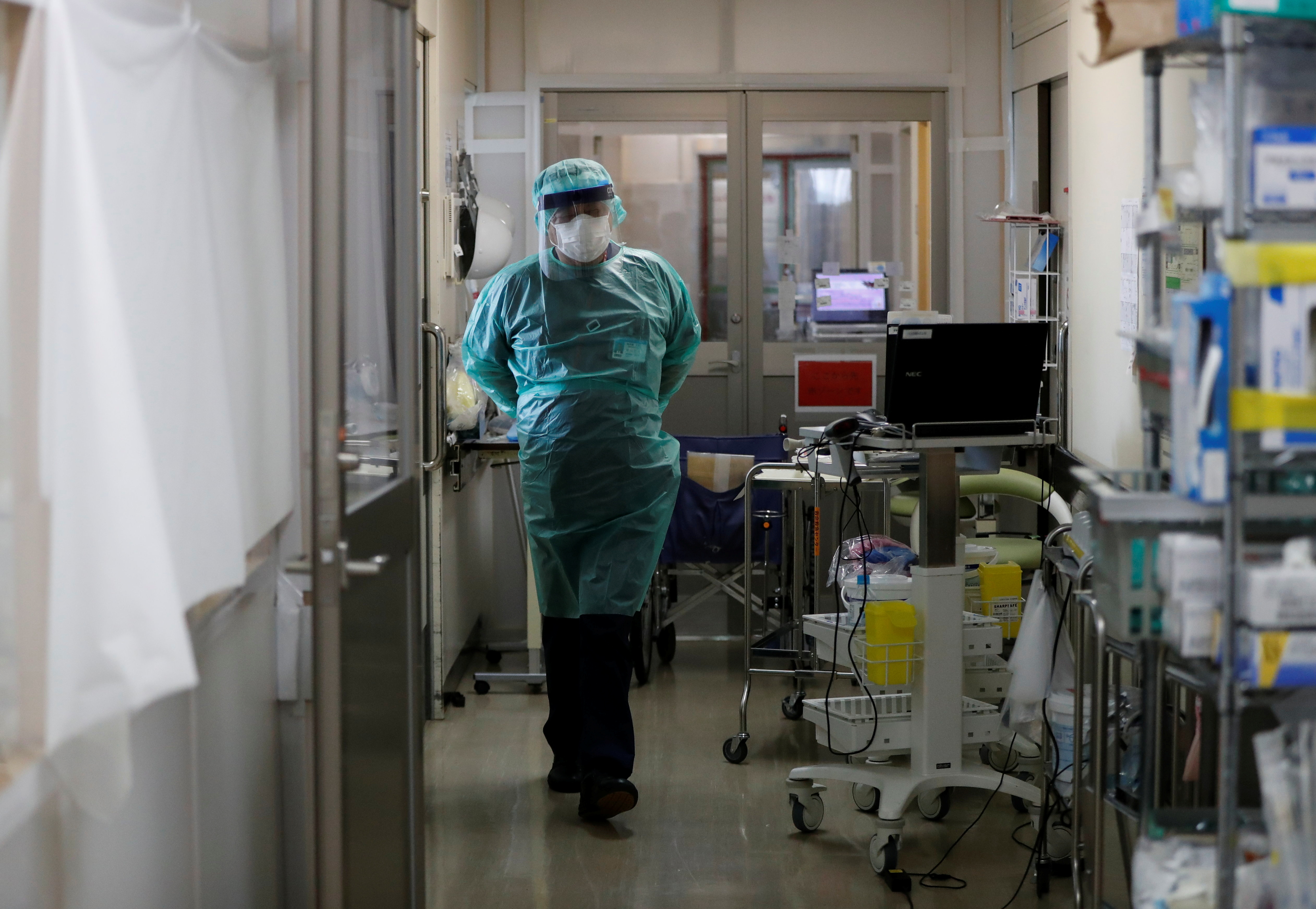 A medical worker walks inside ICU ward at St. Marianna University Yokohama Seibu Hospital where patients suffering from the coronavirus disease (COVID-19) are being treated in Yokohama