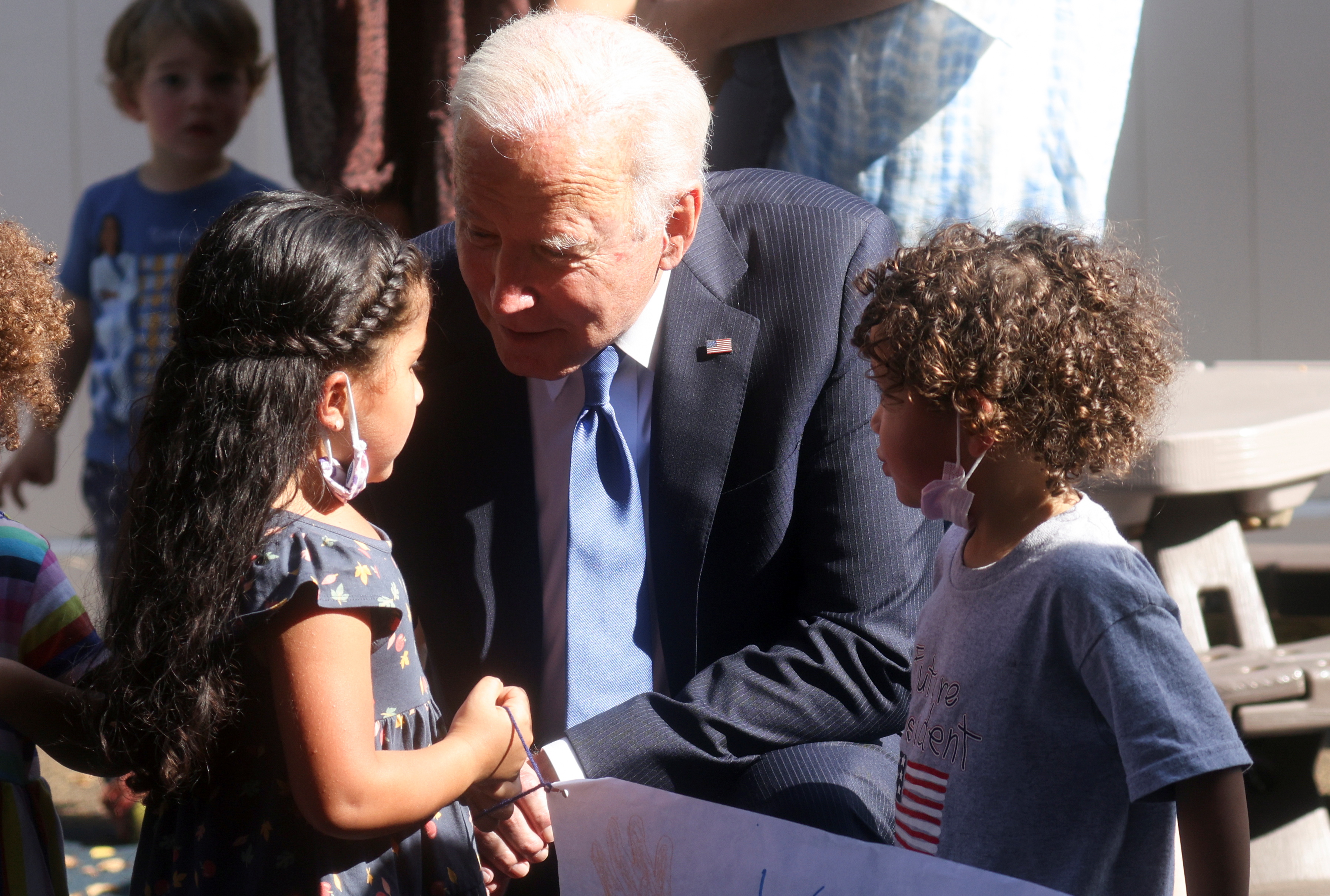 Fund childcare to allow more moms to join workforce, Biden says | Reuters