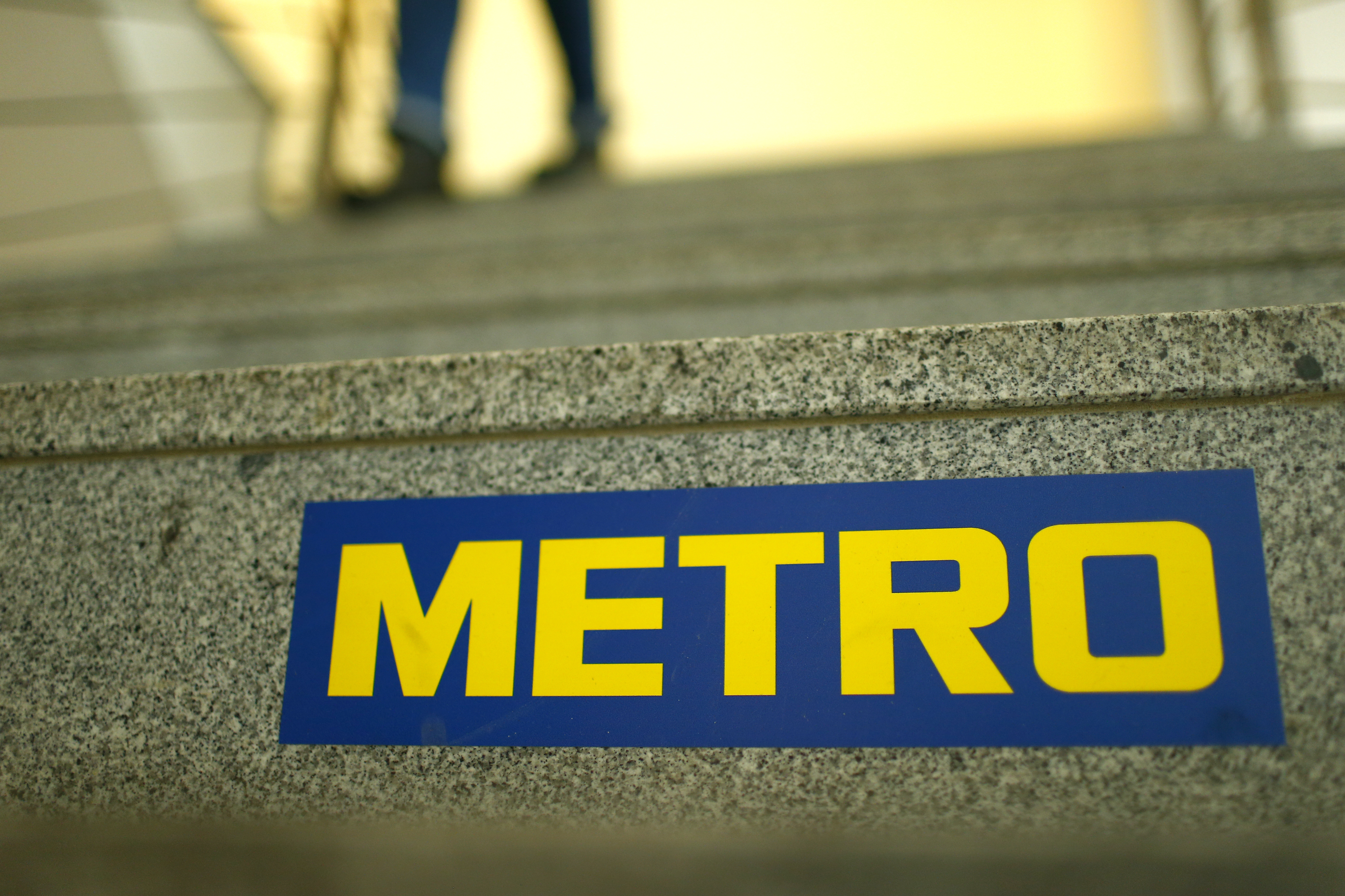 German retailer Metro AG sign is seen on the steps of their headquarters in Duesseldorf