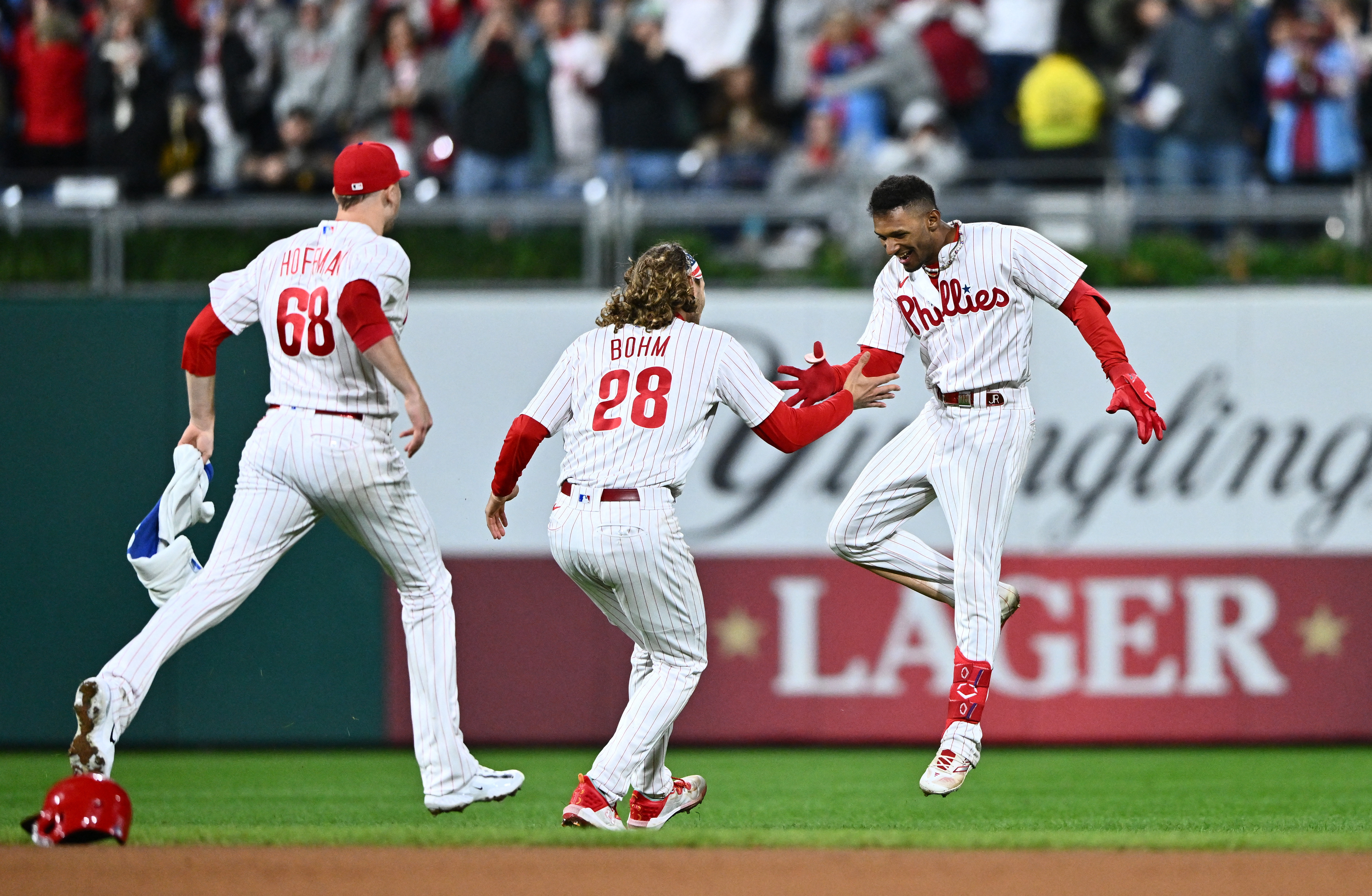 Phillies win in 10 to punch playoff ticket, Baseball