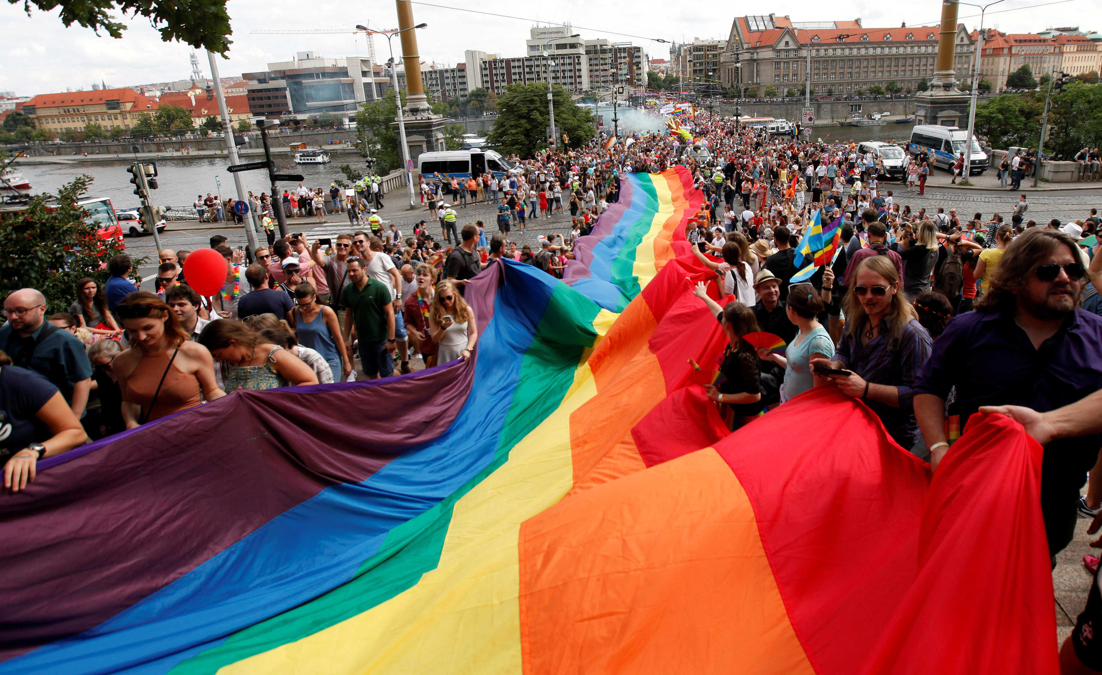 Participants hold a giant rainbow flag during the Prague Pride Parade where thousands marched through the city centre in support of gay rights, in Czech Republic
