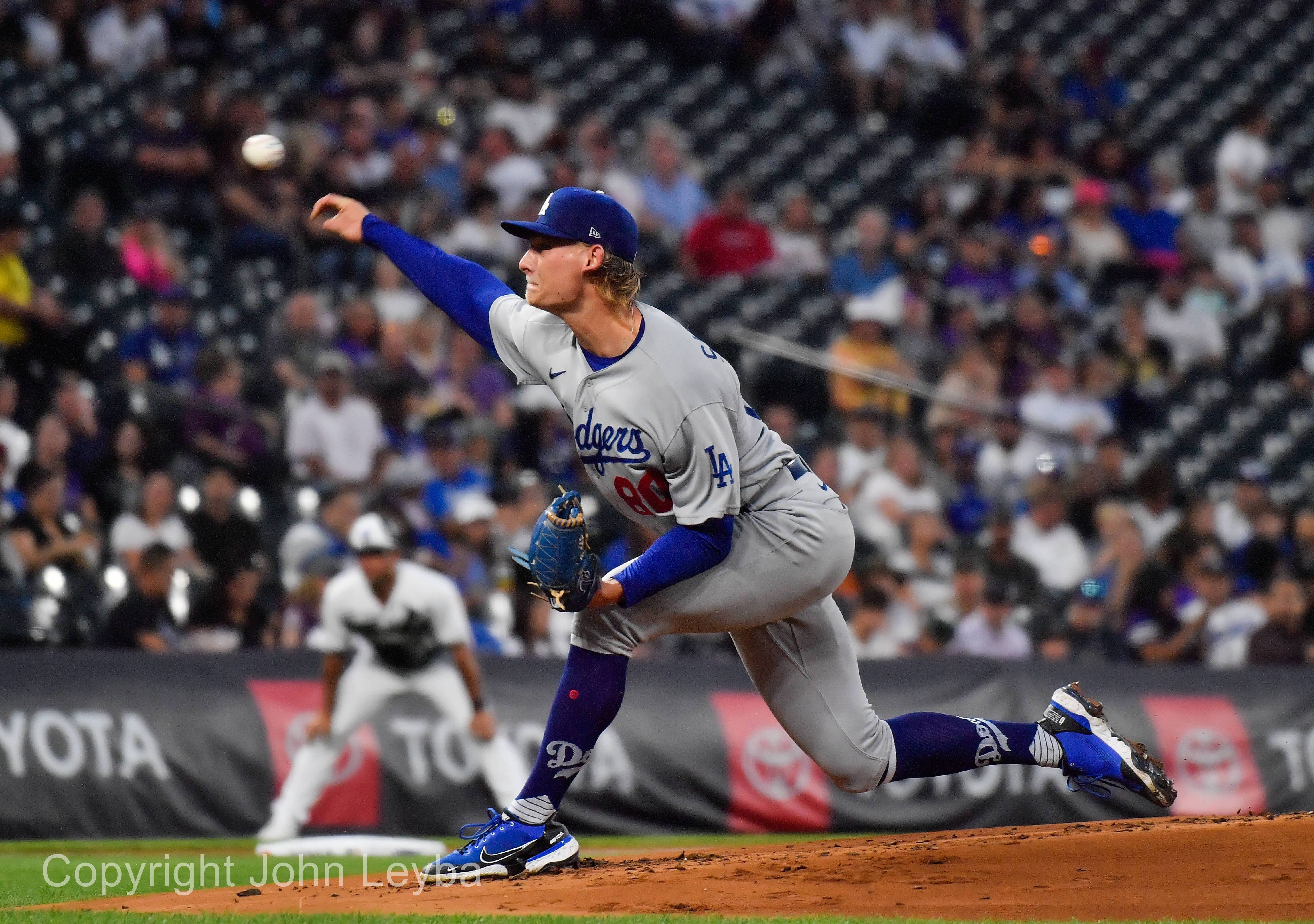 Rockies blast three homers, gain split with Dodgers