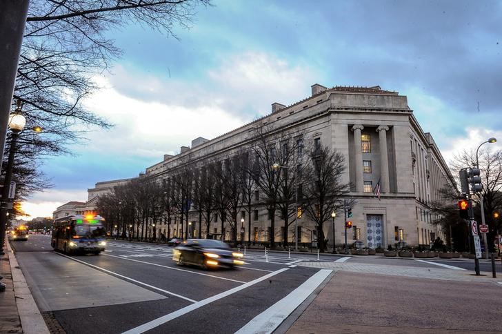 The U.S. Department of Justice building is bathed in morning light at sunrise in Washington