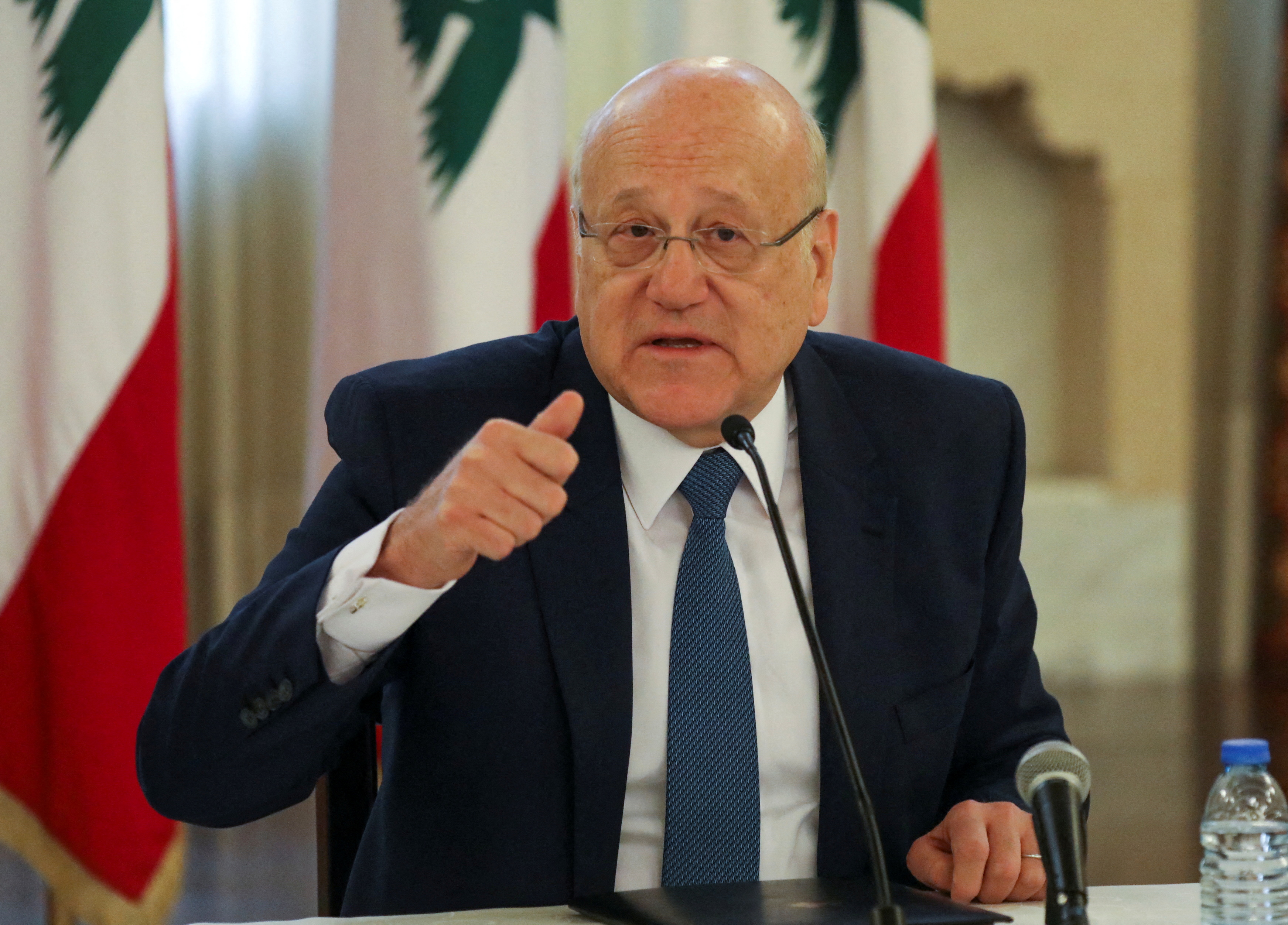 Lebanese Prime Minister Najib Mikati gestures during a news conference on the latest developments in the country at the government palace in Beirut