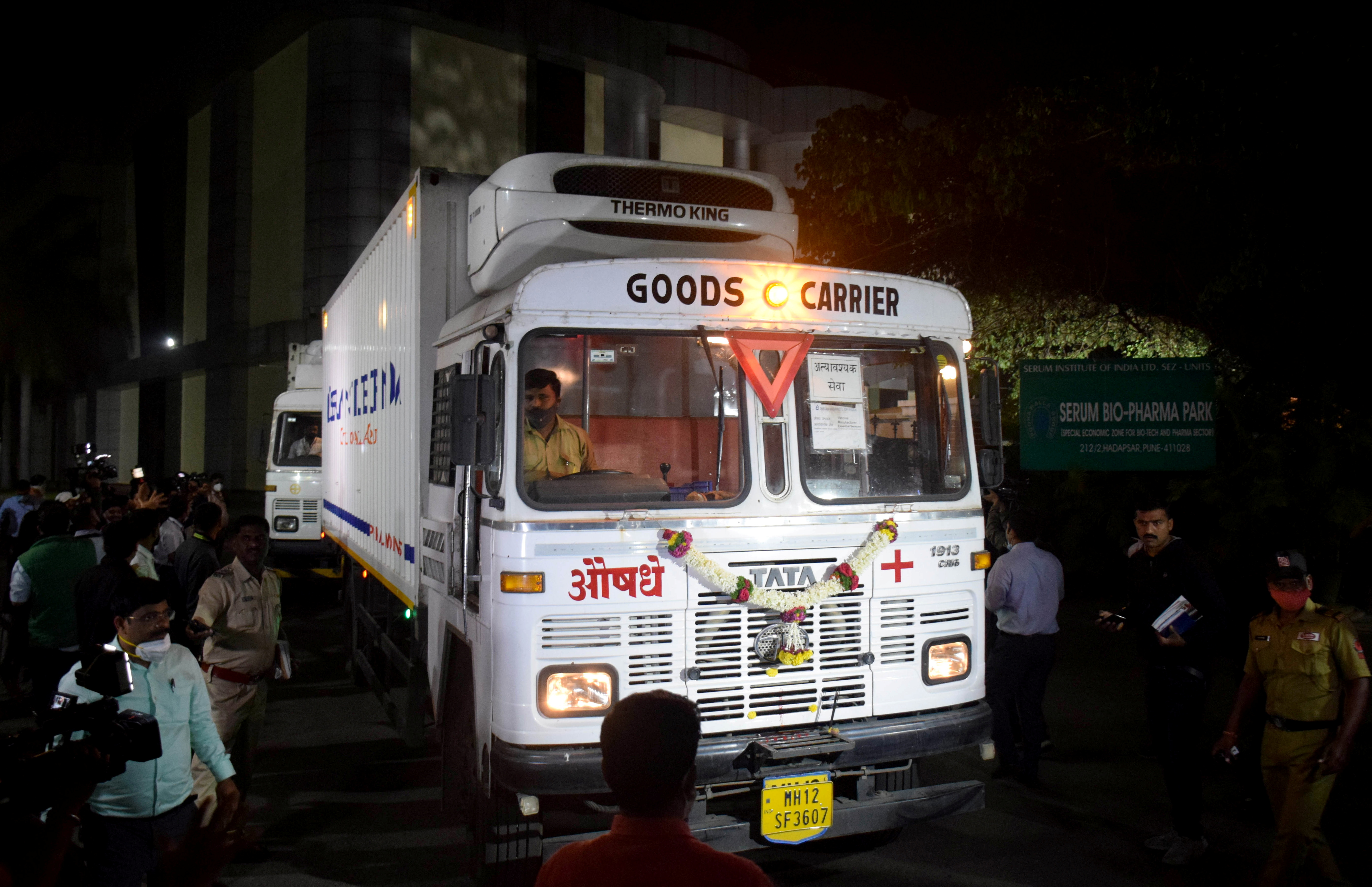 Trucks carrying first consignment of COVISHIELD leave from Serum Bio-Pharma Park of Serum Institute of India, for its distribution, in Pune