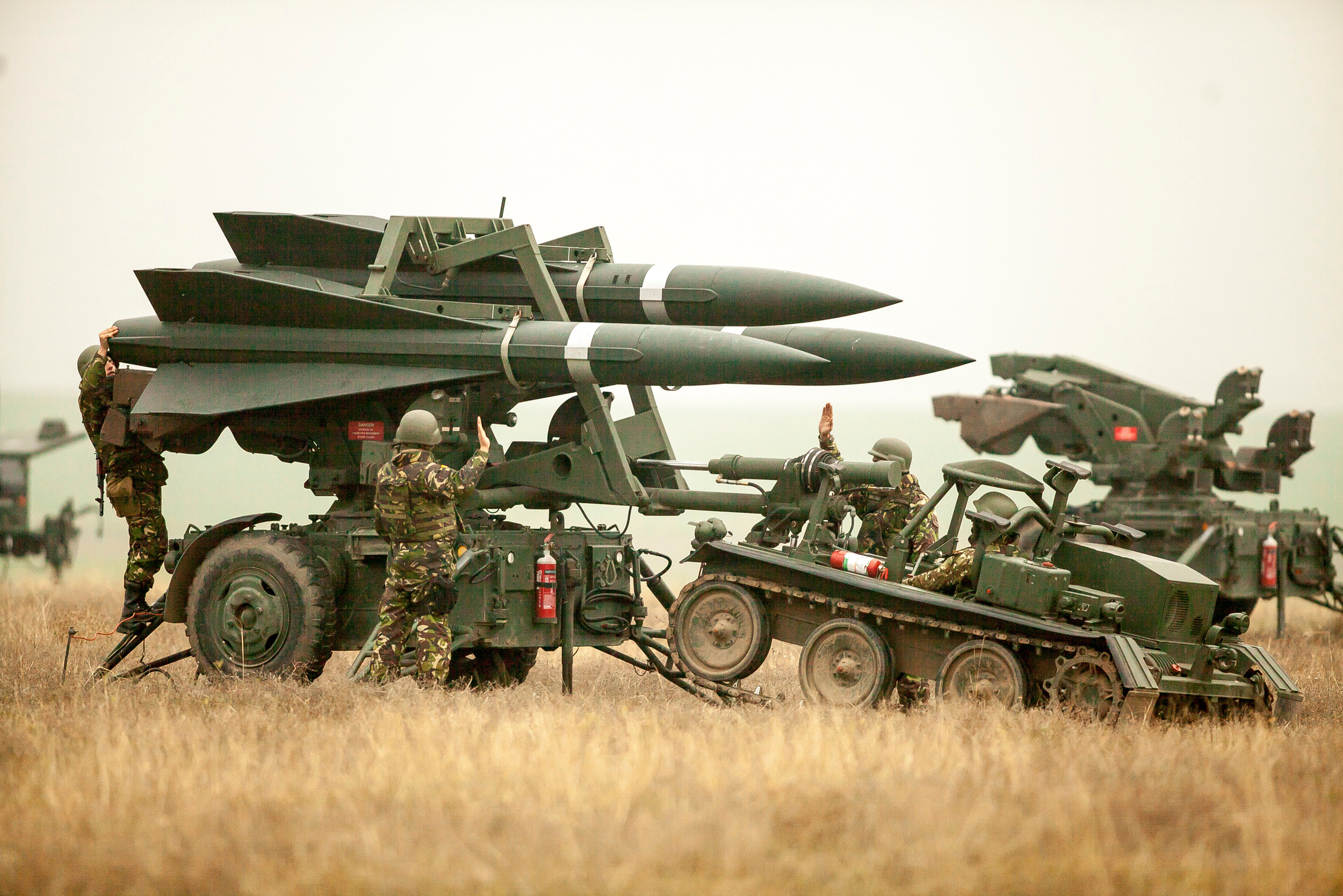 Romanian Army soldiers deploy a HAWK PIP III R ground-to-air missile launch pad during a joint military exercise with the US Army that aimed to test the interoperability of U.S. and Romanian armed forces in the event of a missile attack, near Corbu villag