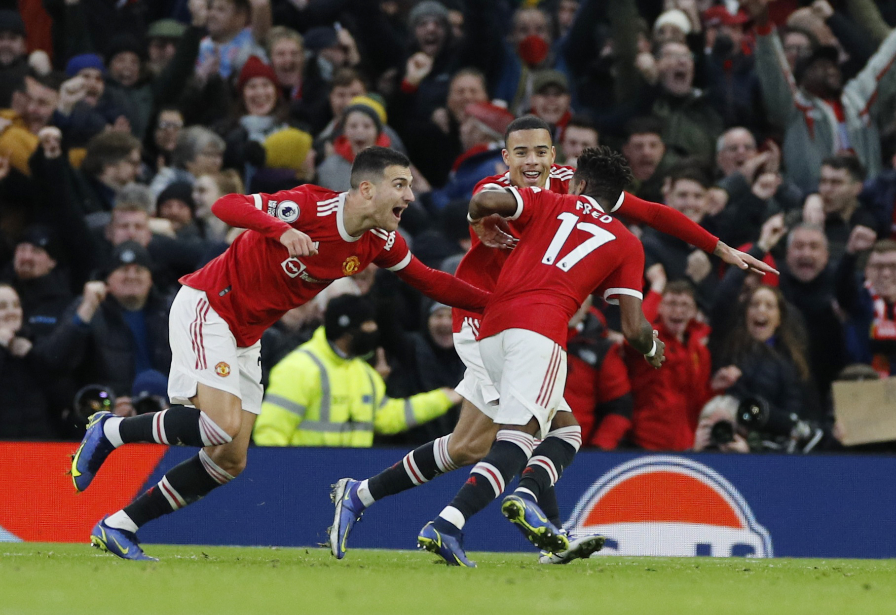 Soccer Football - Premier League - Manchester United v Crystal Palace - Old Trafford, Manchester, Britain - December 5, 2021 Manchester United's Fred celebrates scoring their first goal with Mason Greenwood and Diogo Dalot REUTERS/Phil Noble  