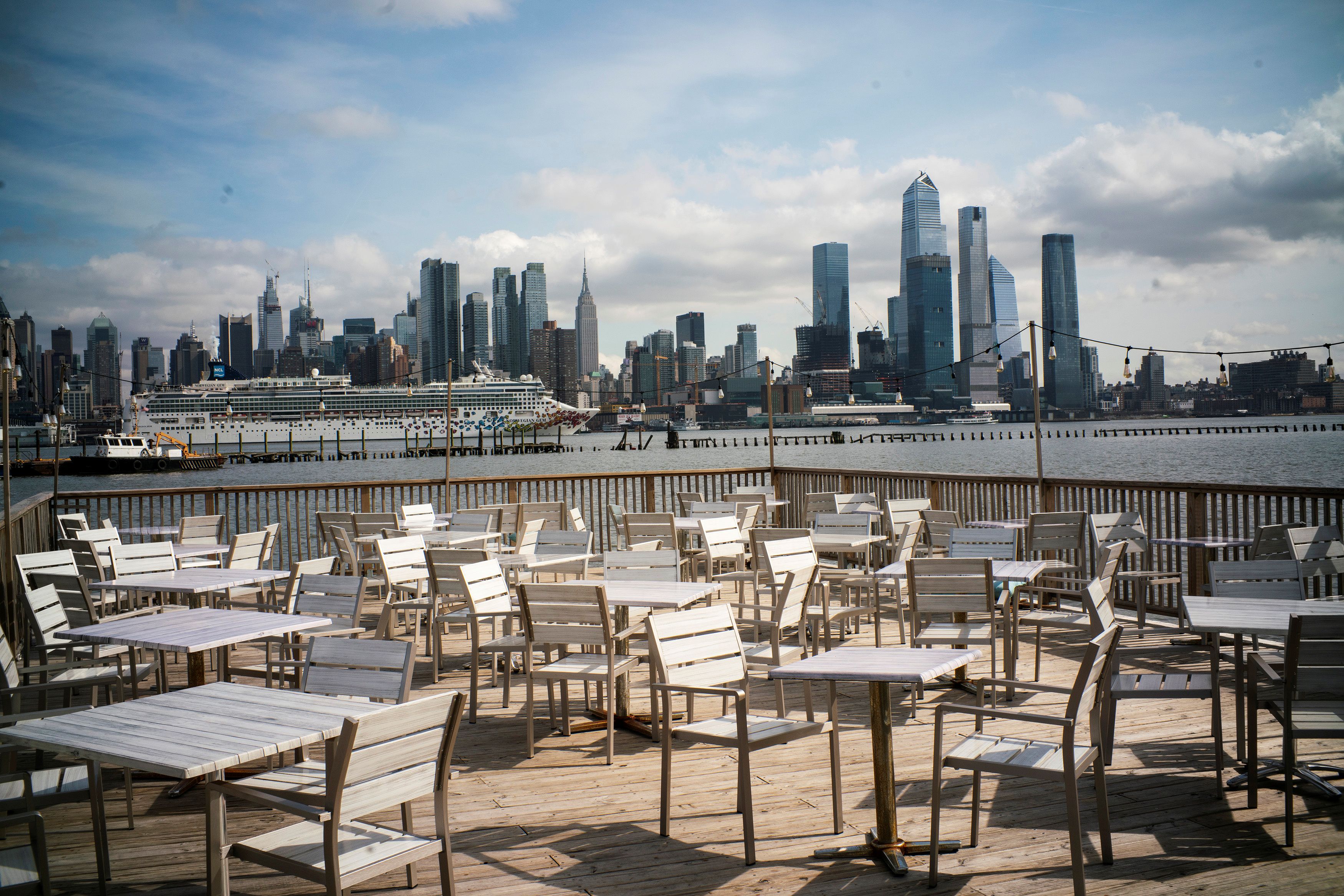 Empty chairs are seen at the deck of a local restaurant that is closed due to the outbreak of coronavirus disease (COVID-19), in Hoboken